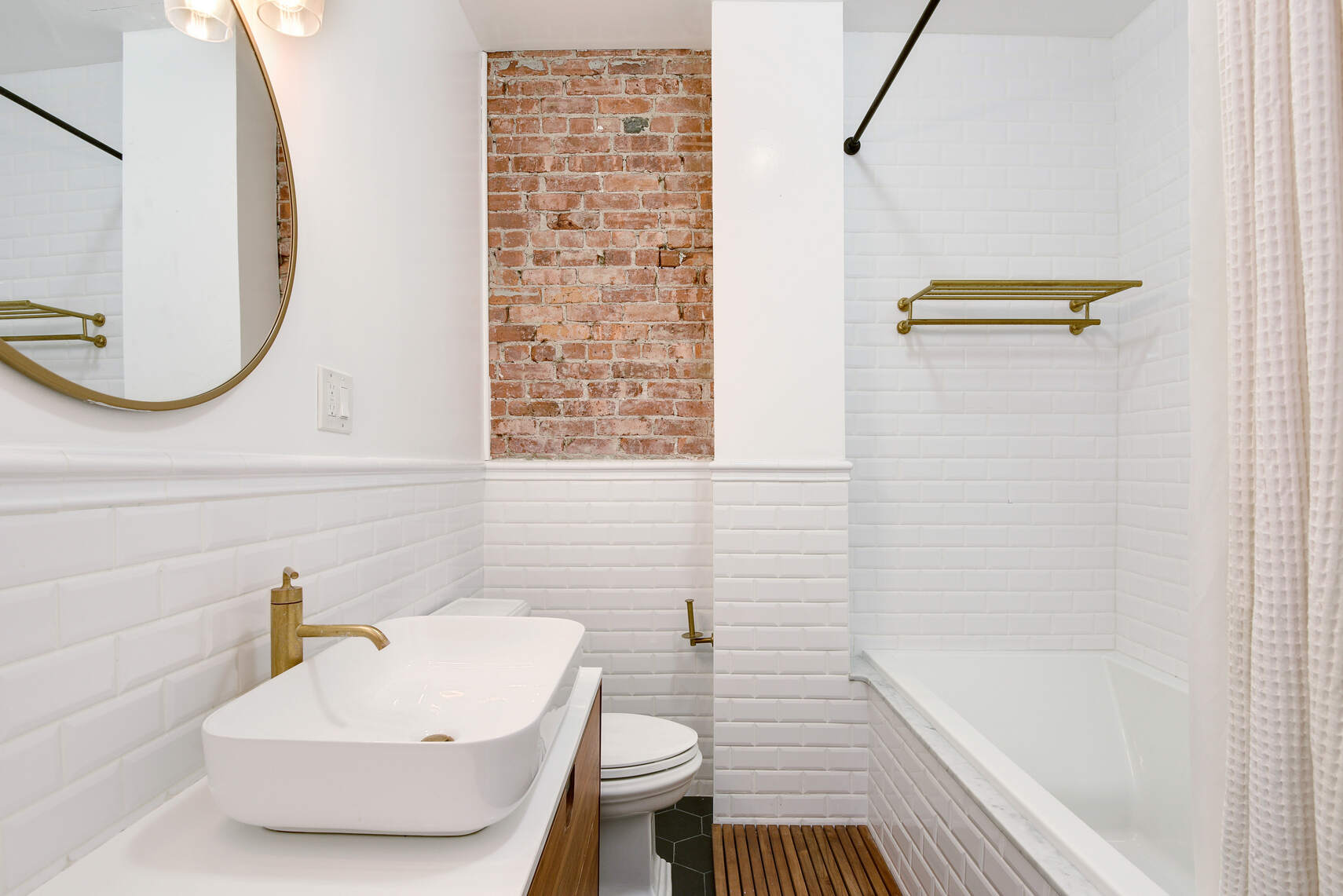 514 Hart Street, Unit PARLOR Brooklyn, NY 11221 - Photo 8 of 9 a bathroom with a sink a toilet and bathtub