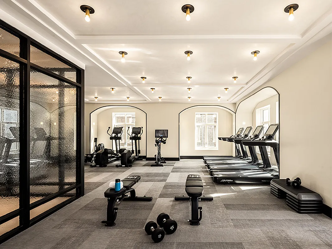 100 Claremont Avenue, Unit 29D Manhattan, NY 10027 - Photo 5 of 9 a view of a room with gym equipment
