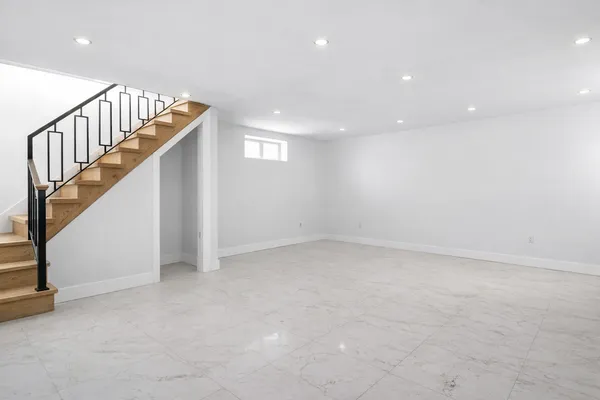 a view of an empty room with stairs
