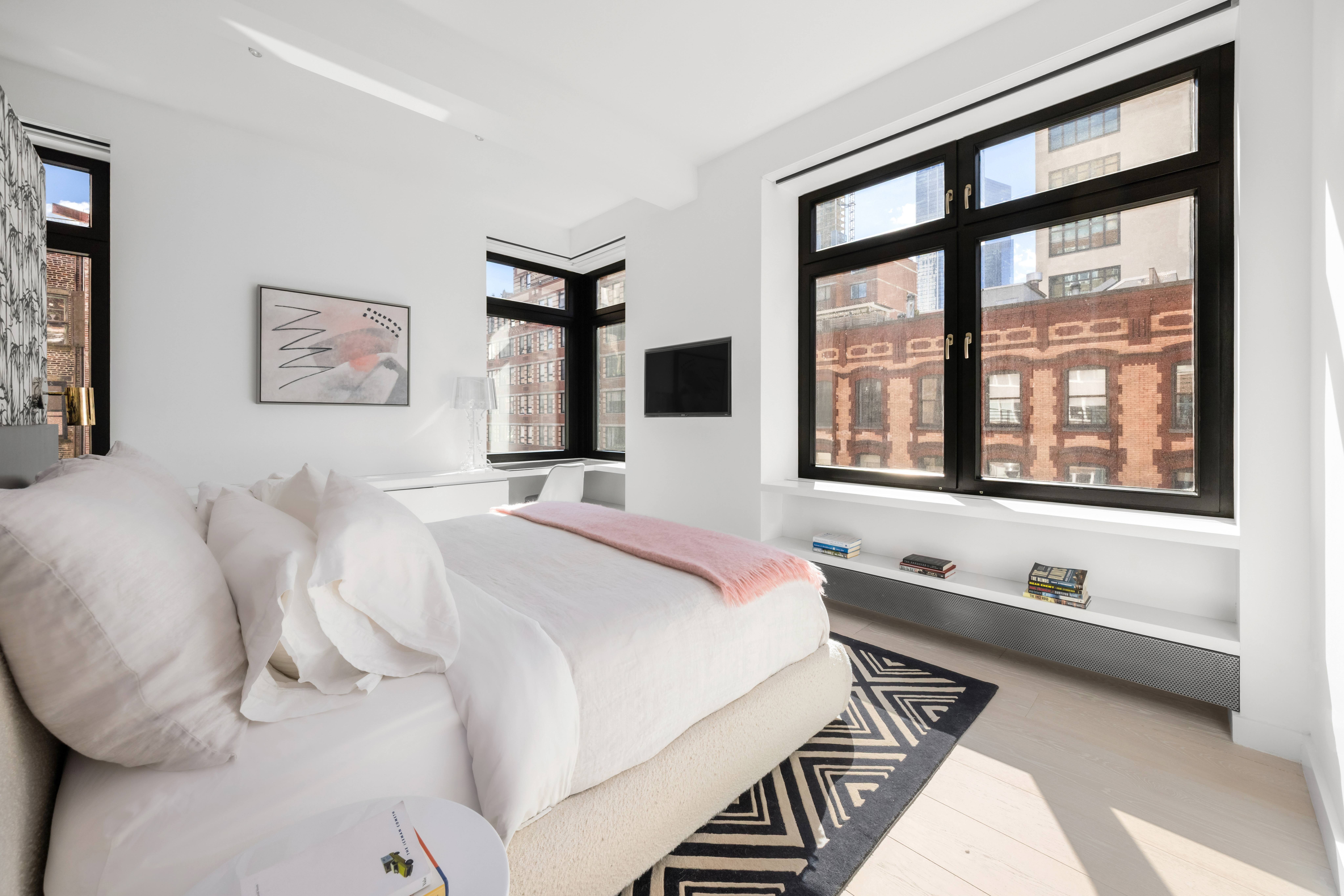 138 Reade Street, Unit 5 Manhattan, NY 10013 - Photo 13 of 23 a bedroom with a bed and a large window