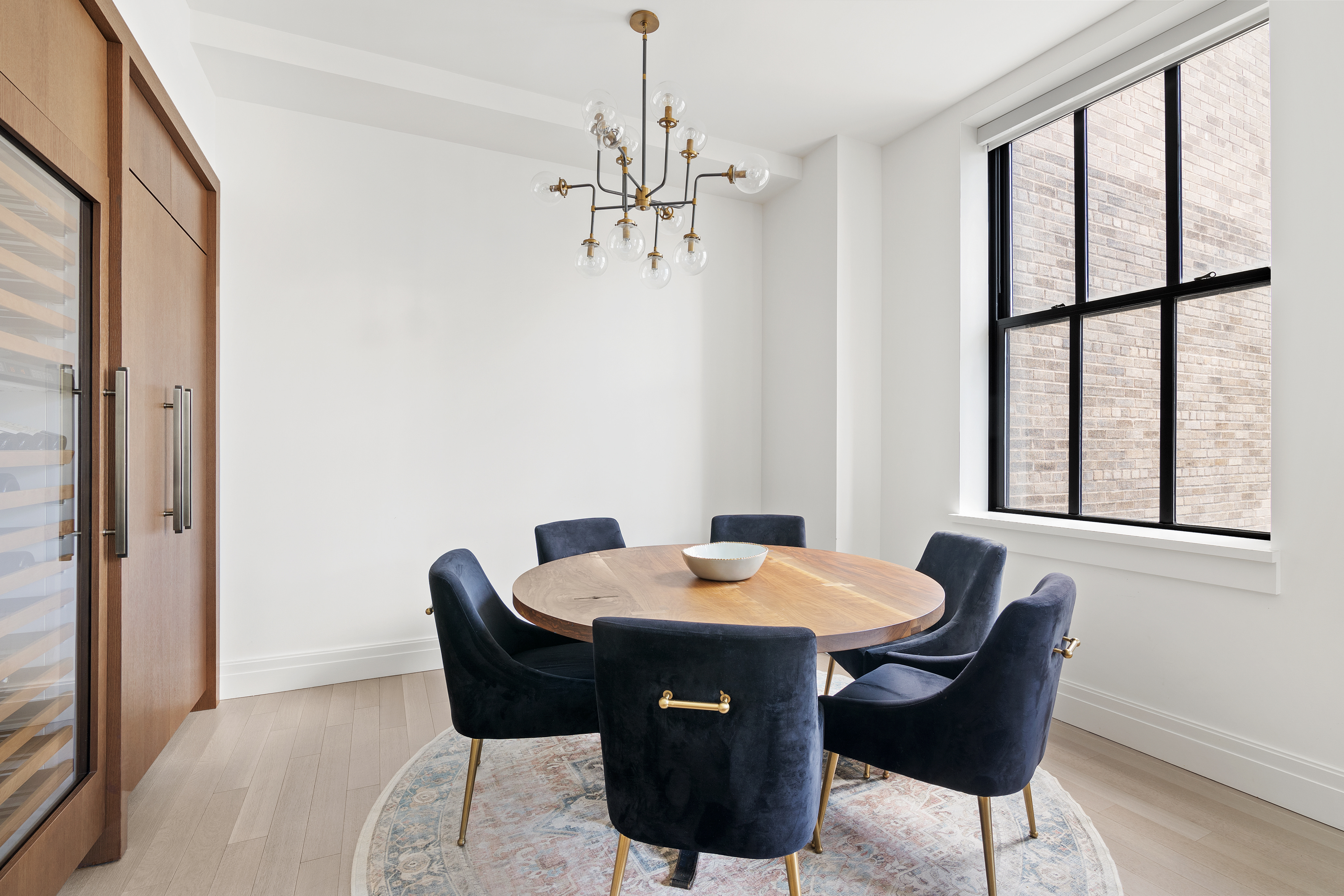 100 Barclay Street, Unit 16D Manhattan, NY 10007 - Photo 4 of 14 a view of a dining room with furniture window and outside view