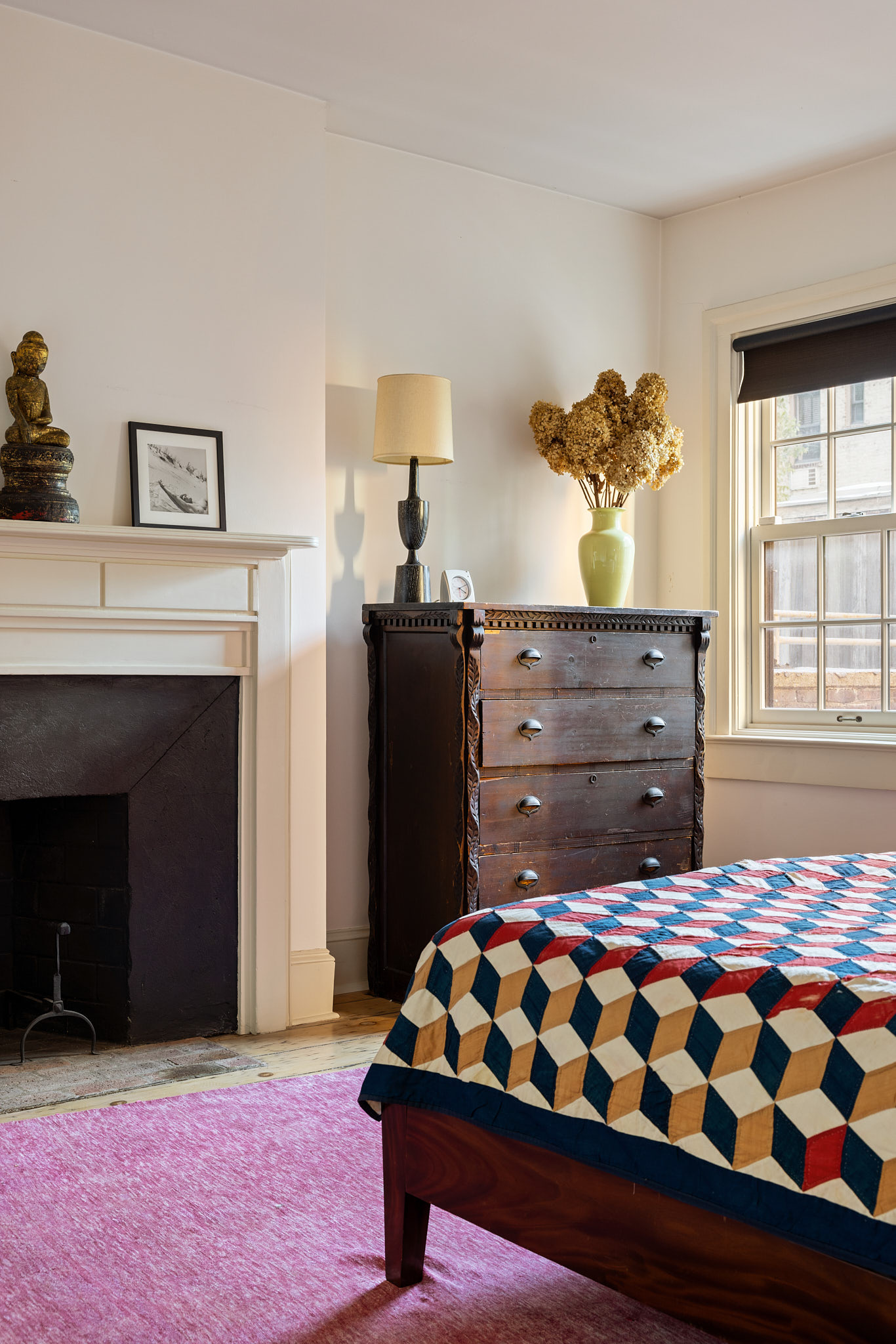 13 Vandam Street Manhattan, NY 10014 - Photo 18 of 26 a bedroom with a bed and a fireplace