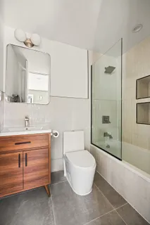 a spacious bedroom with a bed and window