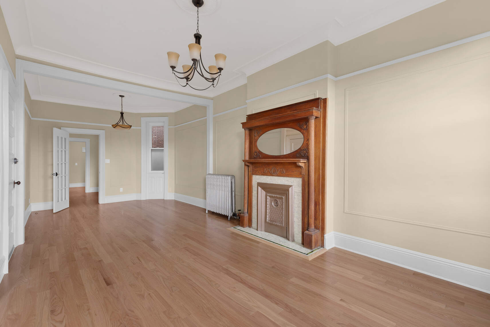 159 Prospect Park West, Unit 4 Brooklyn, NY 11215 - Photo 5 of 14 a view of a hallway with wooden floor and a kitchen