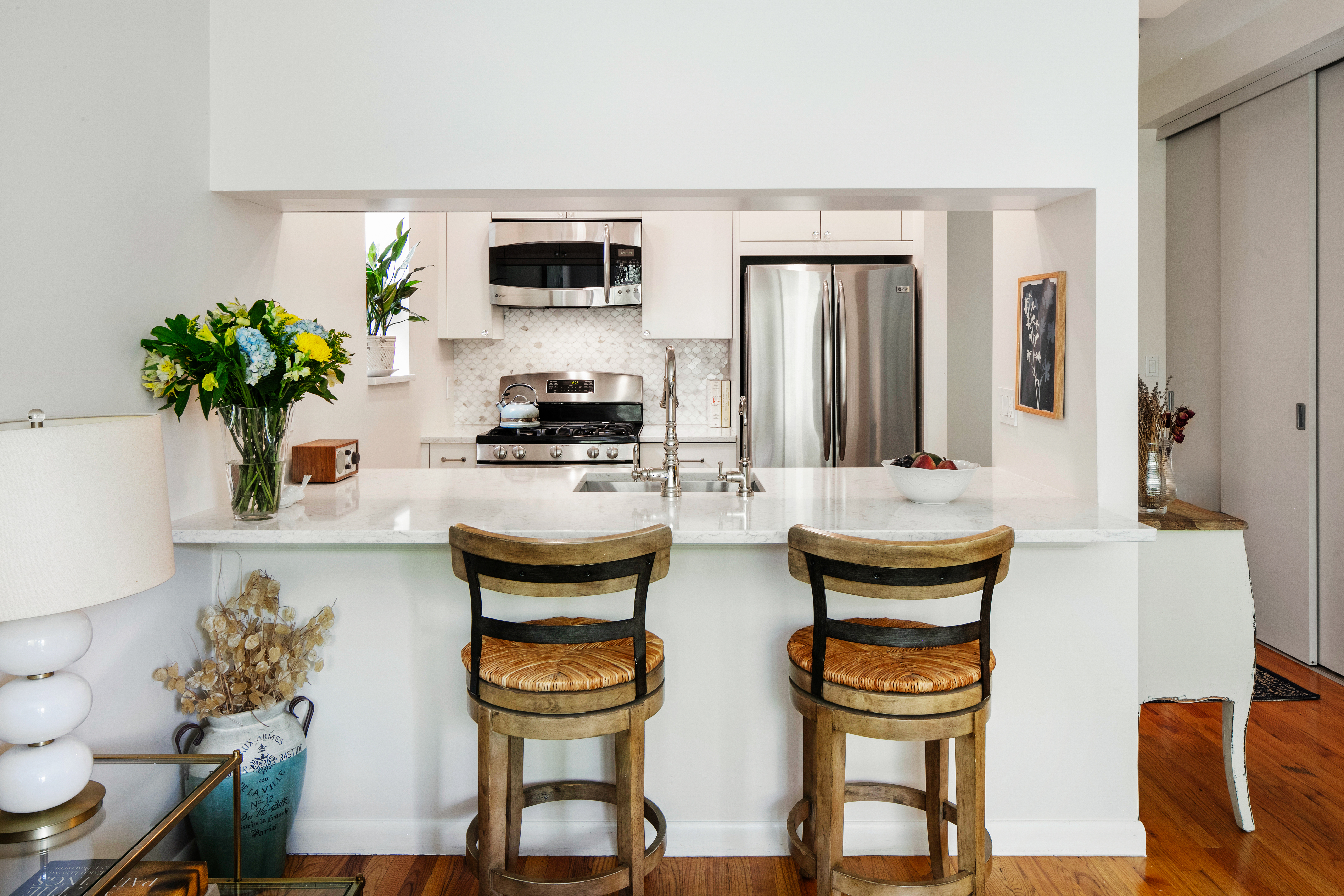 5 West 127th Street, Unit 3B Manhattan, NY 10027 - Photo 5 of 9 a kitchen with a table and chairs
