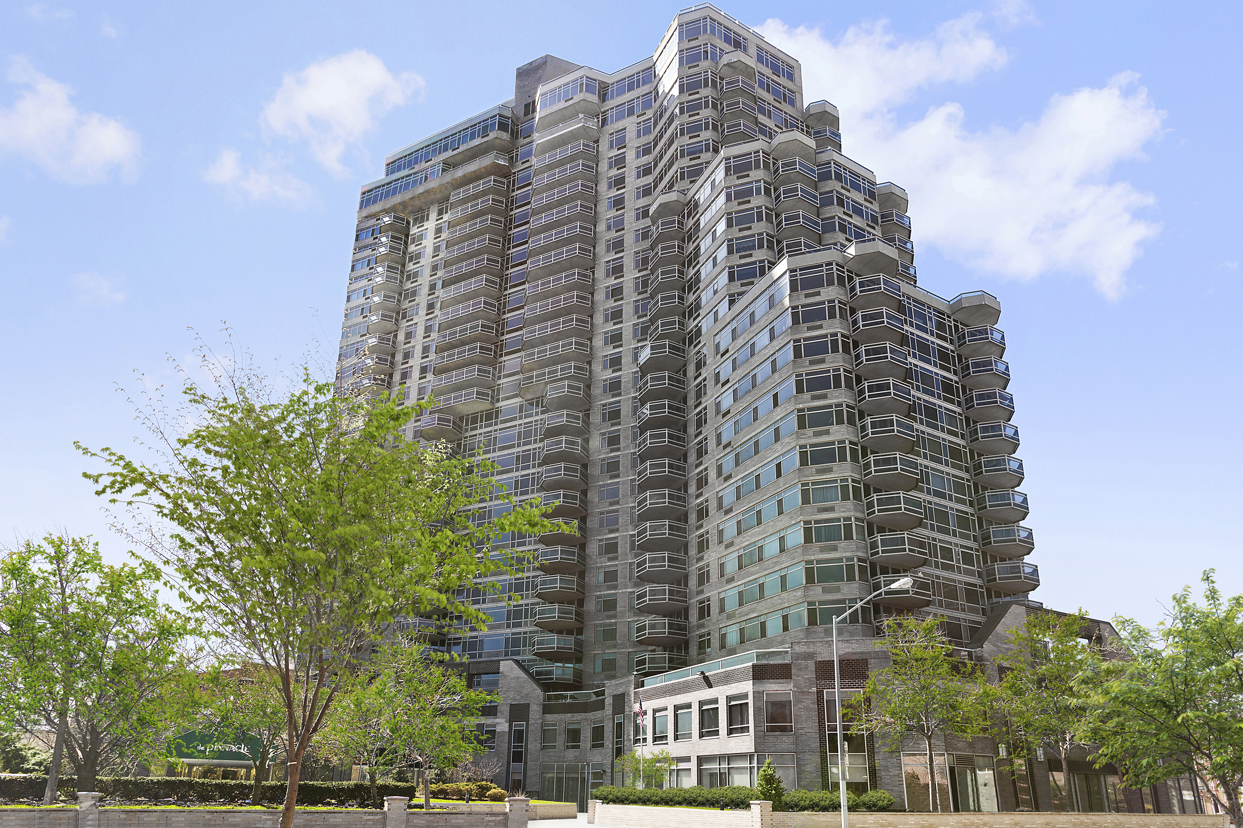 112-01 Queens Boulevard, Unit 17H Queens, NY 11375 - Photo 21 of 26 a tall building sitting next to a city view