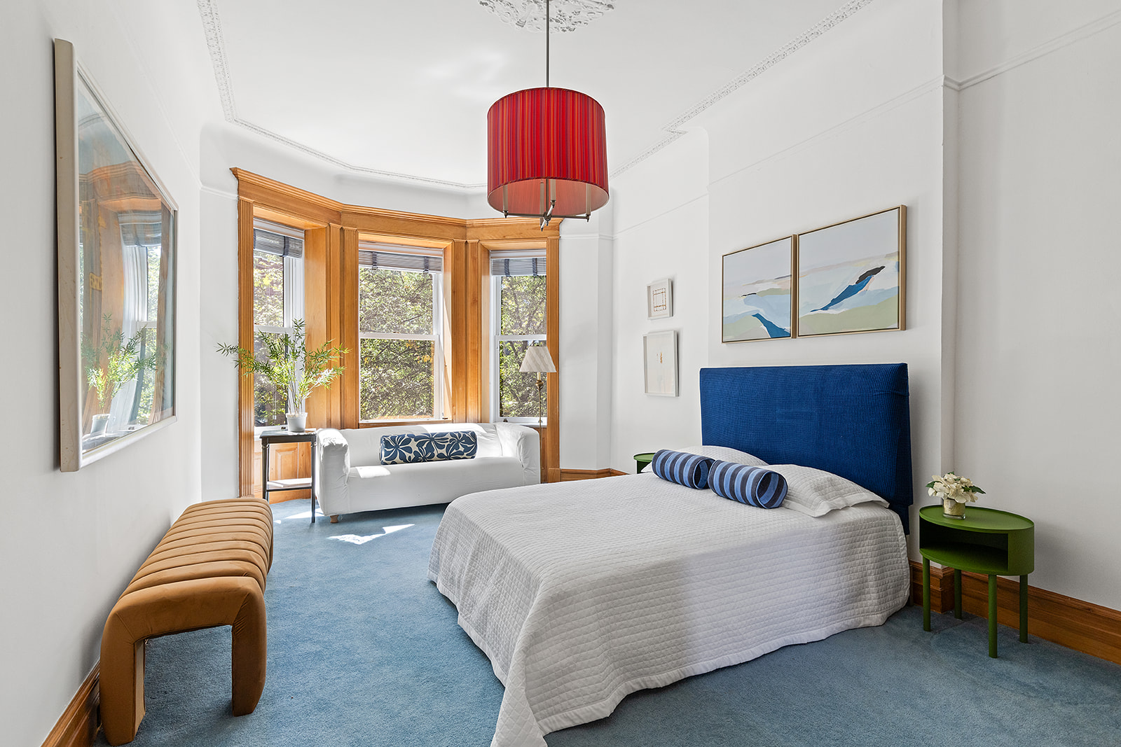 623 2nd Street Brooklyn, NY 11215 - Photo 16 of 26 a bedroom with a bed and a chandelier