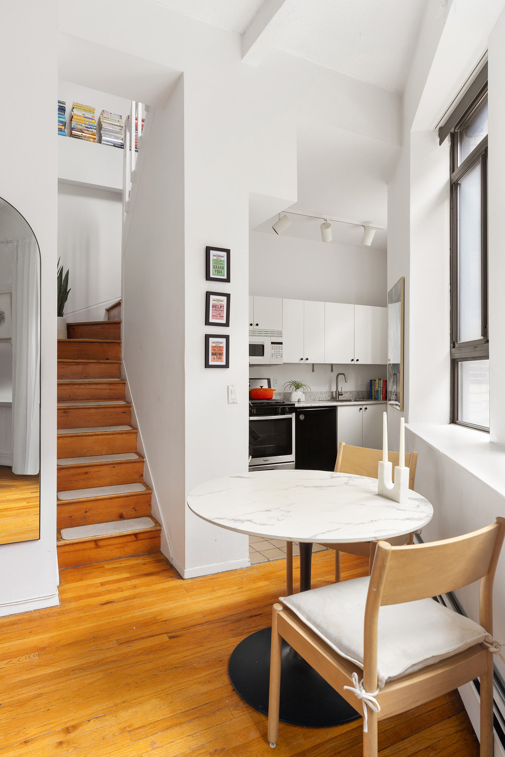 2 Cornelia Street, Unit 201 Manhattan, NY 10014 - Photo 3 of 11 a view of kitchen with cabinets and wooden floor