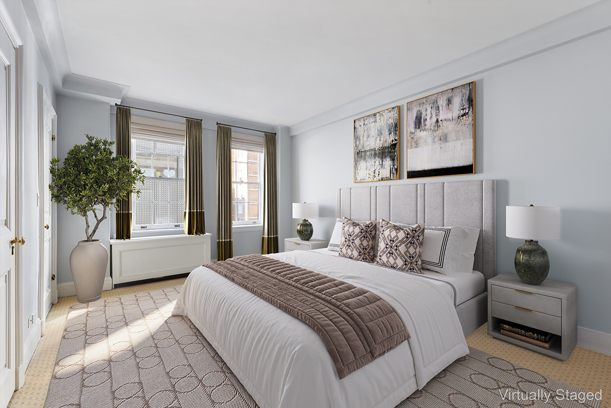 447 East 57th Street, Unit 14 Manhattan, NY 10022 - Photo 11 of 26 a bedroom with a large bed and a couch