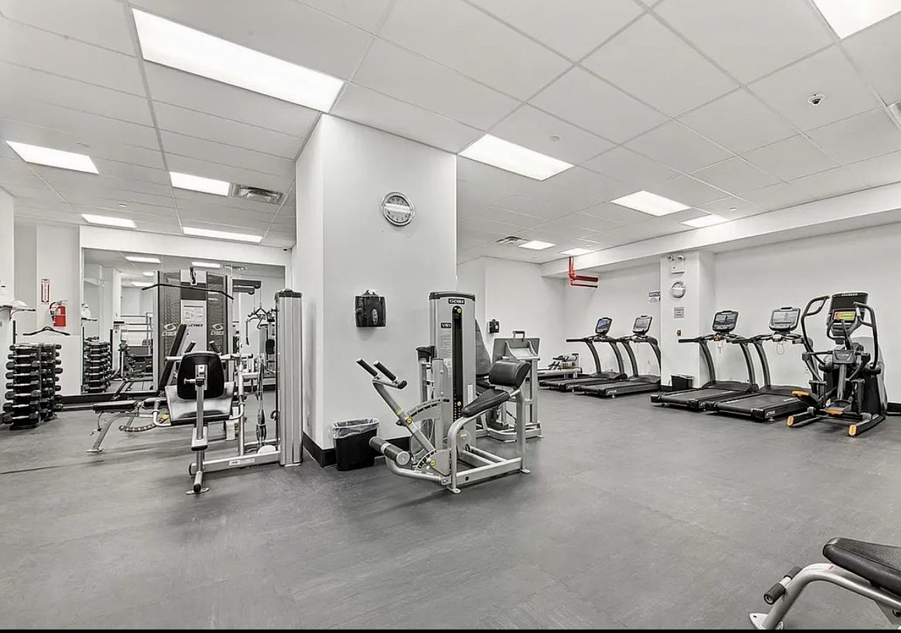 400 East 56th Street, Unit 38S Manhattan, NY 10022 - Photo 14 of 16 a view of a room with gym equipment
