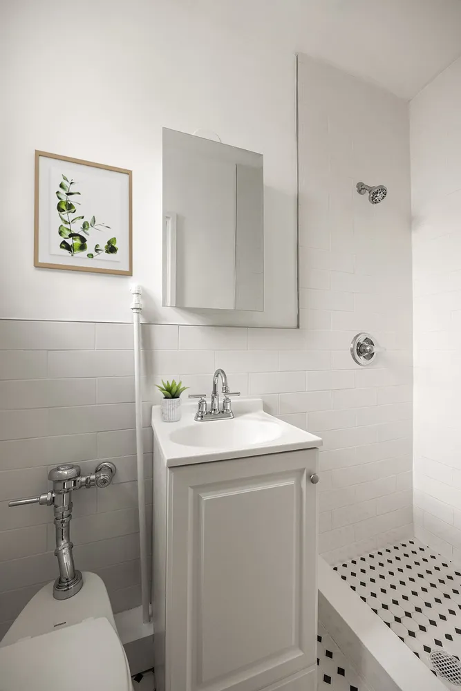 a bathroom with a sink toilet and vanity