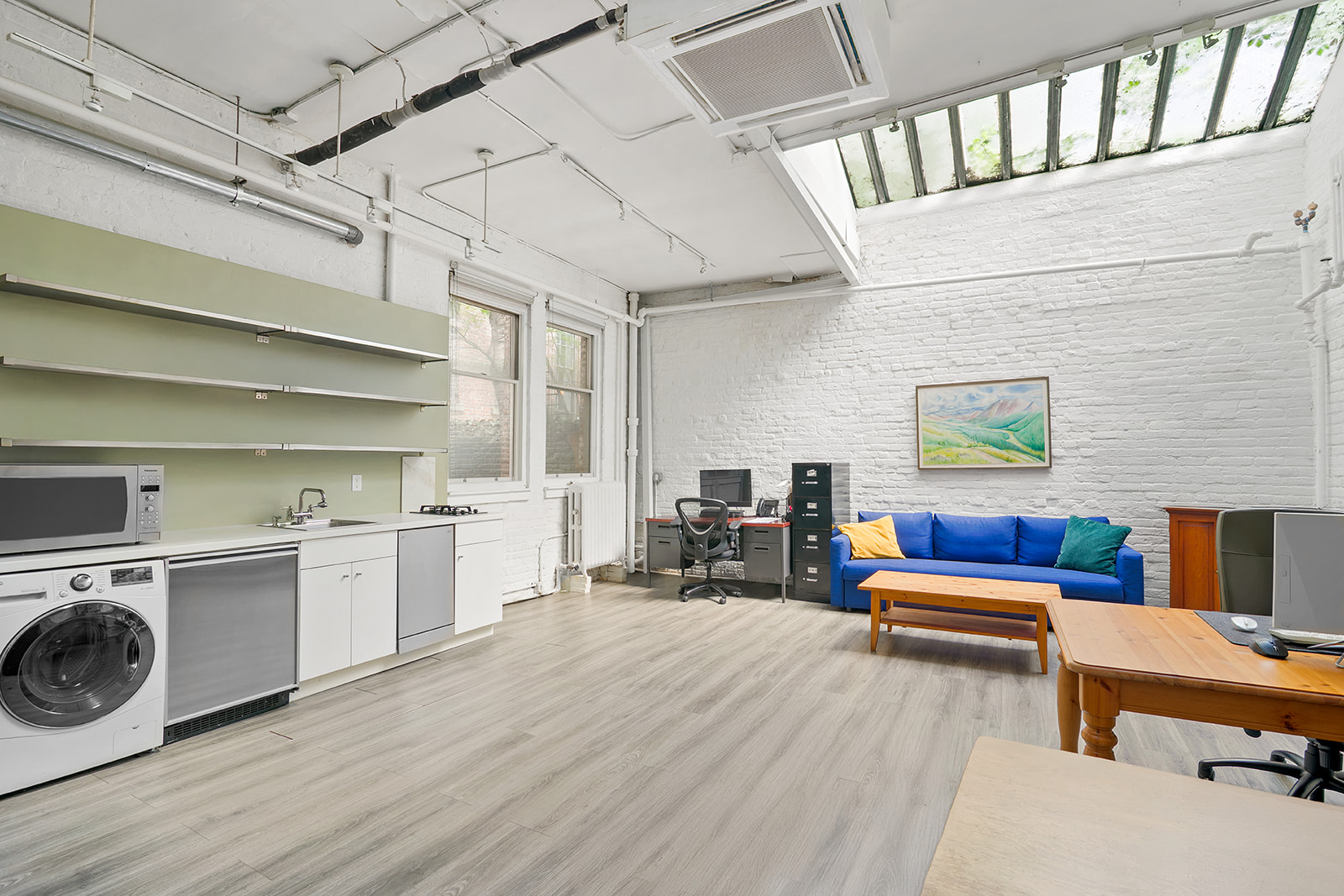 198 6th Avenue Manhattan, NY 10013 - Photo 36 of 45 a view of living room kitchen with stainless steel appliances wooden floor and furniture
