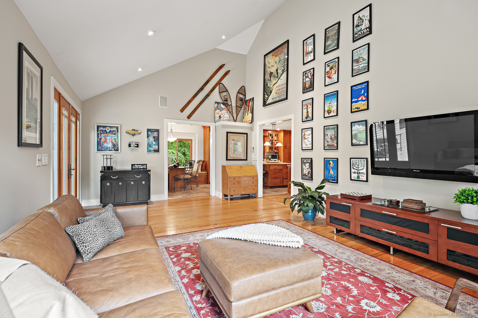 13 Bittersweet Road Weston, CT 06883 - Photo 11 of 35 a living room with furniture and a flat screen tv