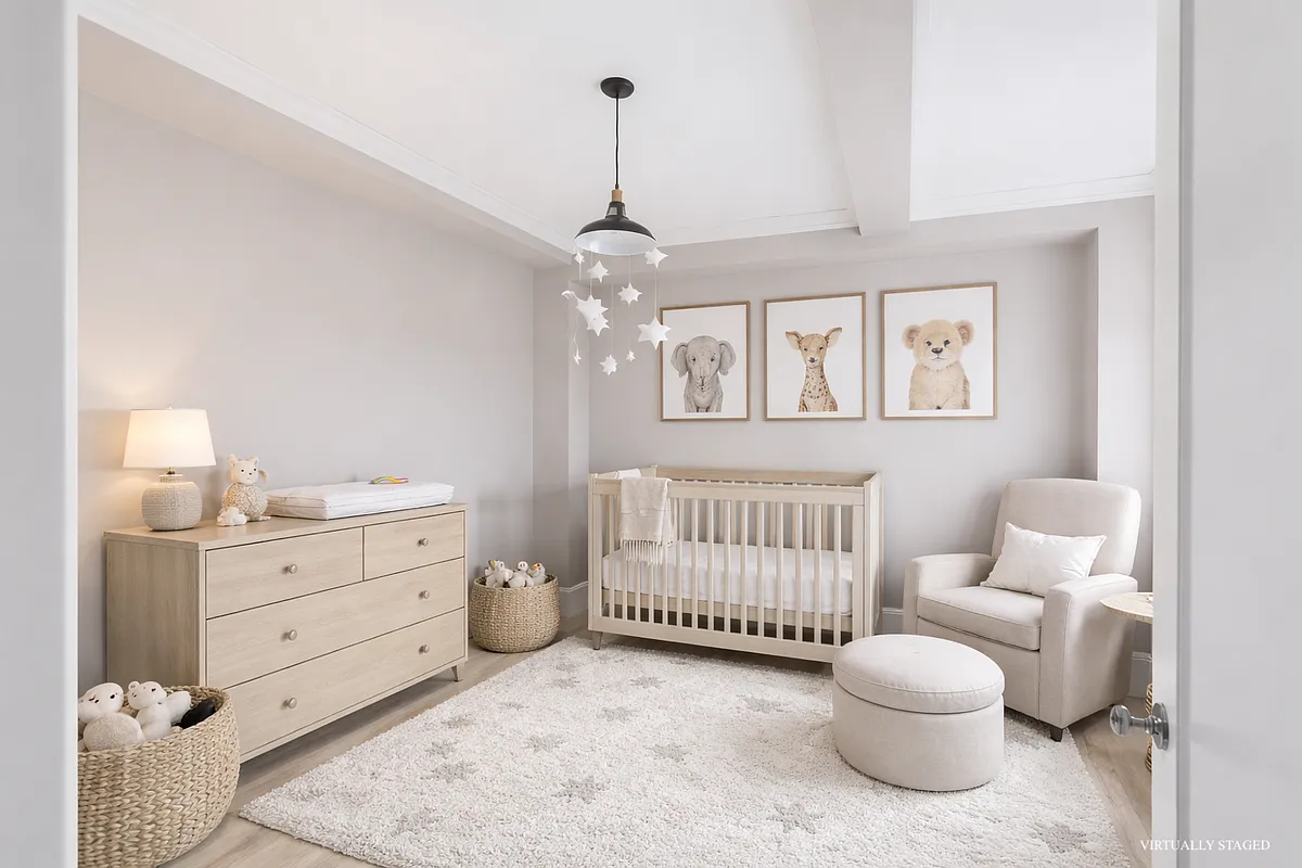 167 East 82nd Street, Unit 9B Manhattan, NY 10028 - Photo 12 of 15 a bedroom with furniture and baby crib