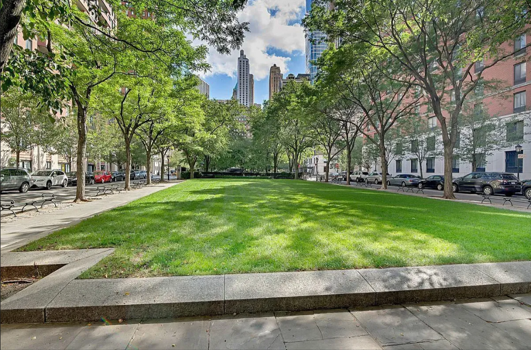 225 Rector Place, Unit 2D Manhattan, NY 10280 - Photo 15 of 17 a view of a park with many windows