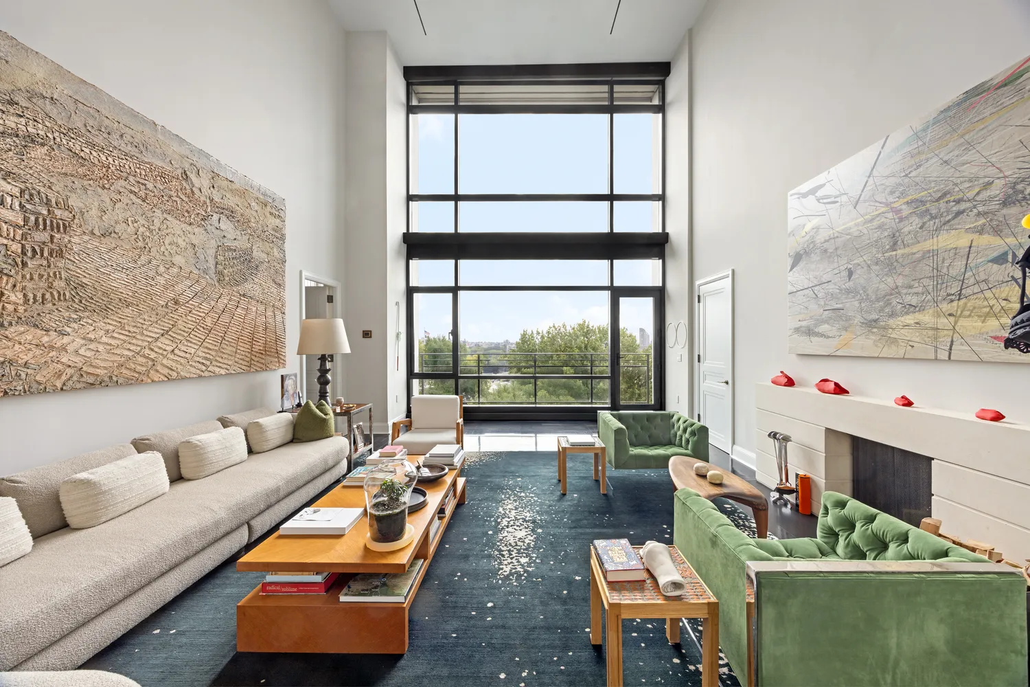 a living room with furniture and a floor to ceiling window