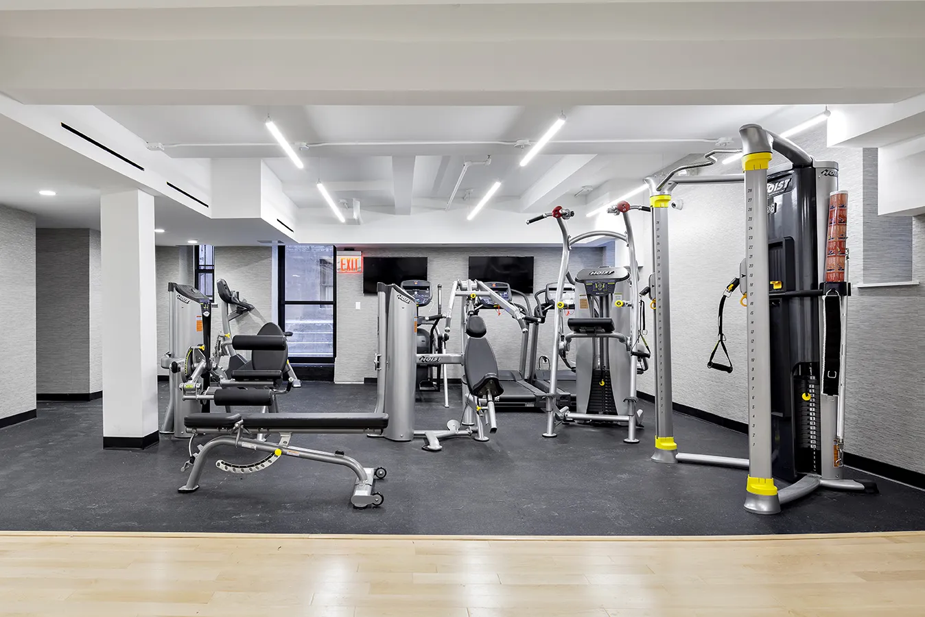 a room with gym equipment and gym equipment