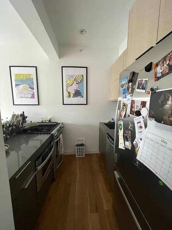 500 Sterling Place, Unit 3H Brooklyn, NY 11238 - Photo 4 of 12 a view of a kitchen with fridge and workspace