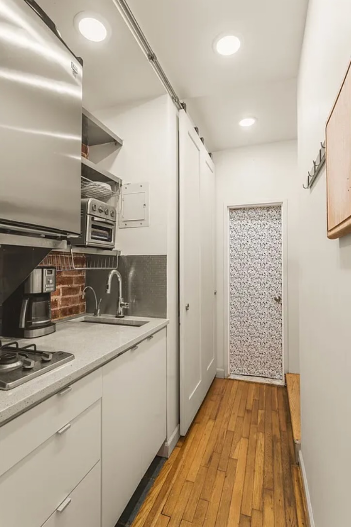 430 East 87th Street, Unit 2A Manhattan, NY 10128 - Photo 5 of 8 a bathroom with a sink and a mirror