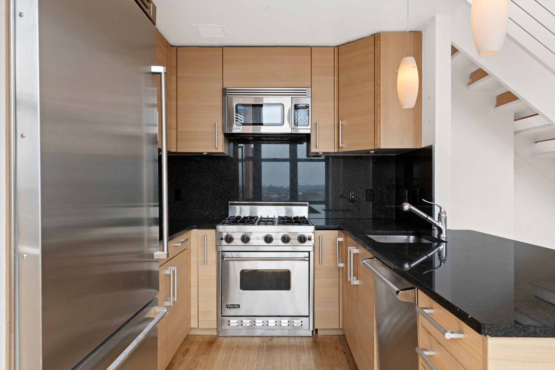 199 State Street, Unit PHD Brooklyn, NY 11201 - Photo 5 of 11 a kitchen with a stove and a microwave
