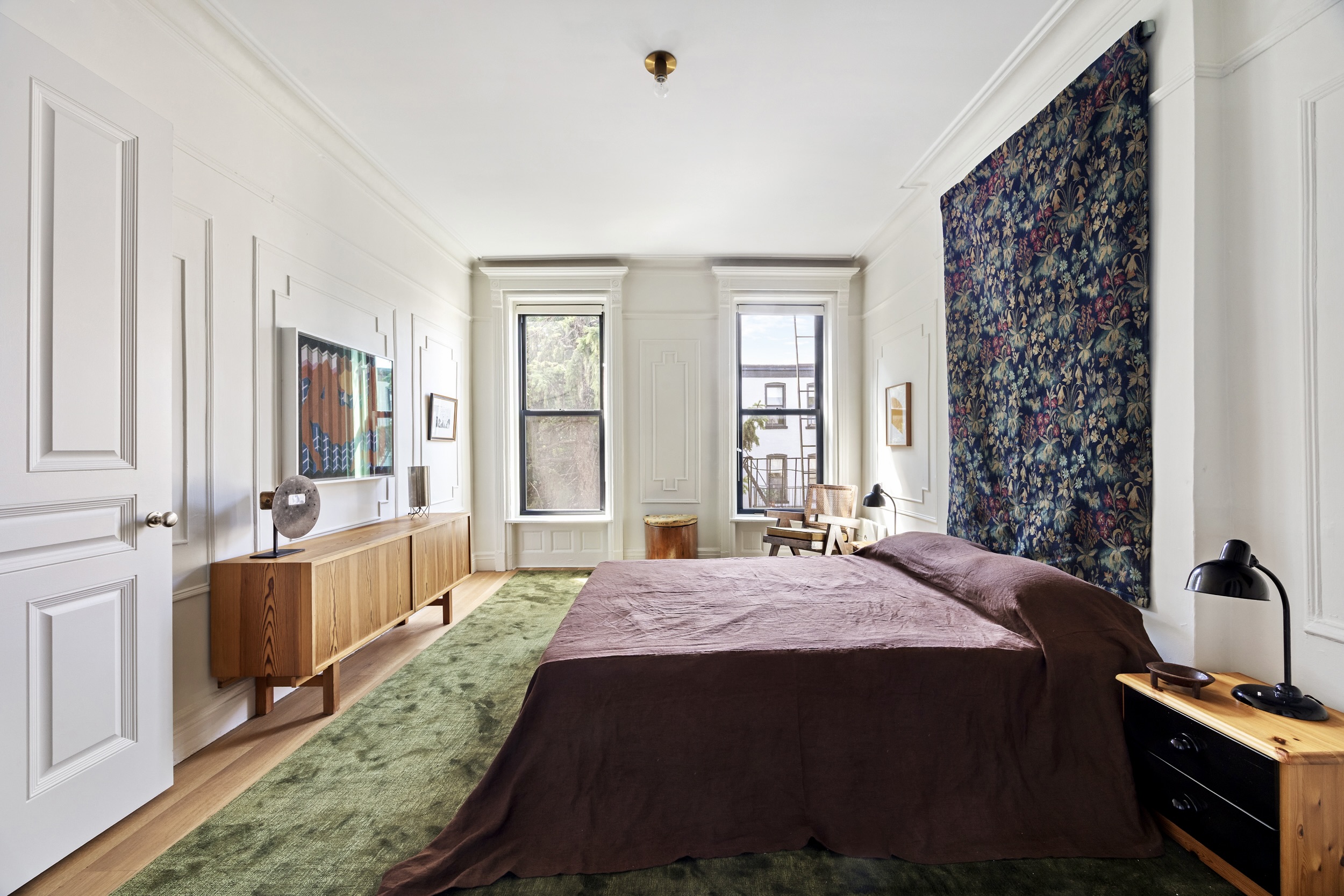 134 Berkeley Place, Unit 3 Brooklyn, NY 11217 - Photo 15 of 30 a bedroom with a bed and a chandelier