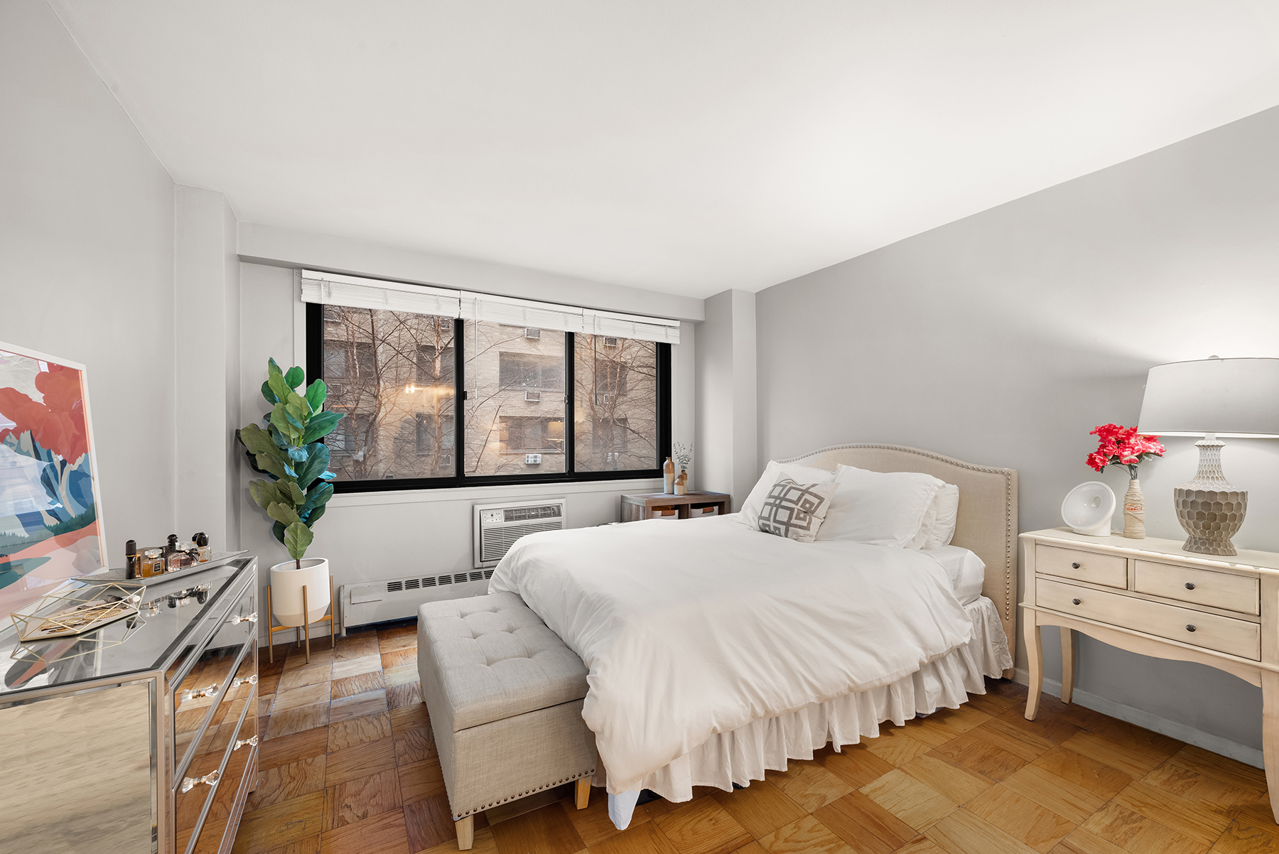 16 West 16th Street, Unit 3FS Manhattan, NY 10011 - Photo 2 of 12 a bedroom with a bed and a large window
