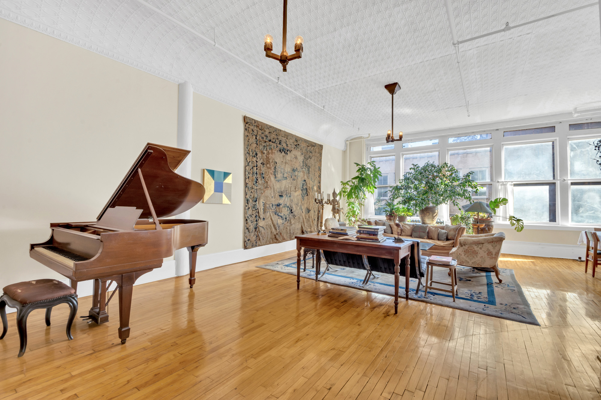 69 Wooster Street, Unit 3 Manhattan, NY 10012 - Photo 3 of 22 a living room with furniture wooden floor and a window