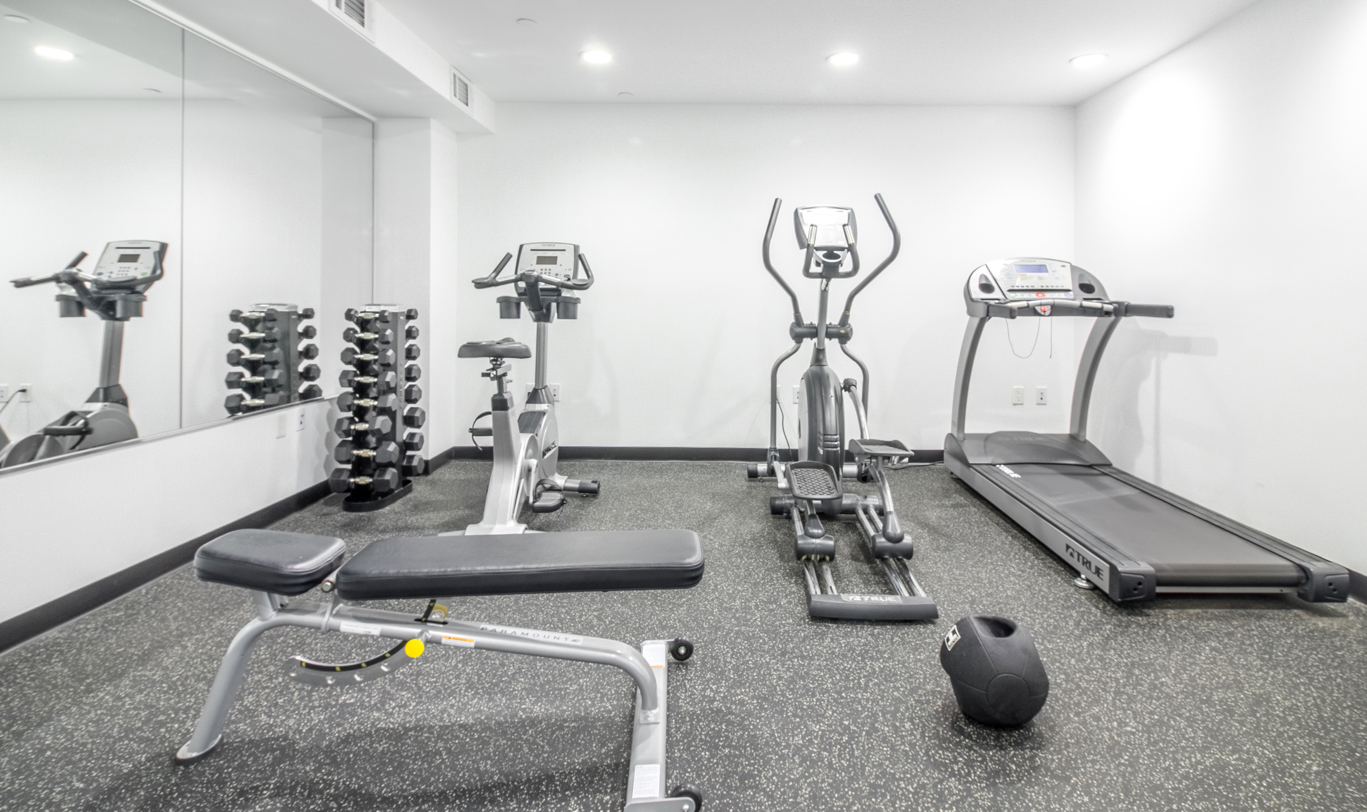 51 East 131st Street, Unit 6A Manhattan, NY 10037 - Photo 11 of 12 a room with gym equipment and view of living room