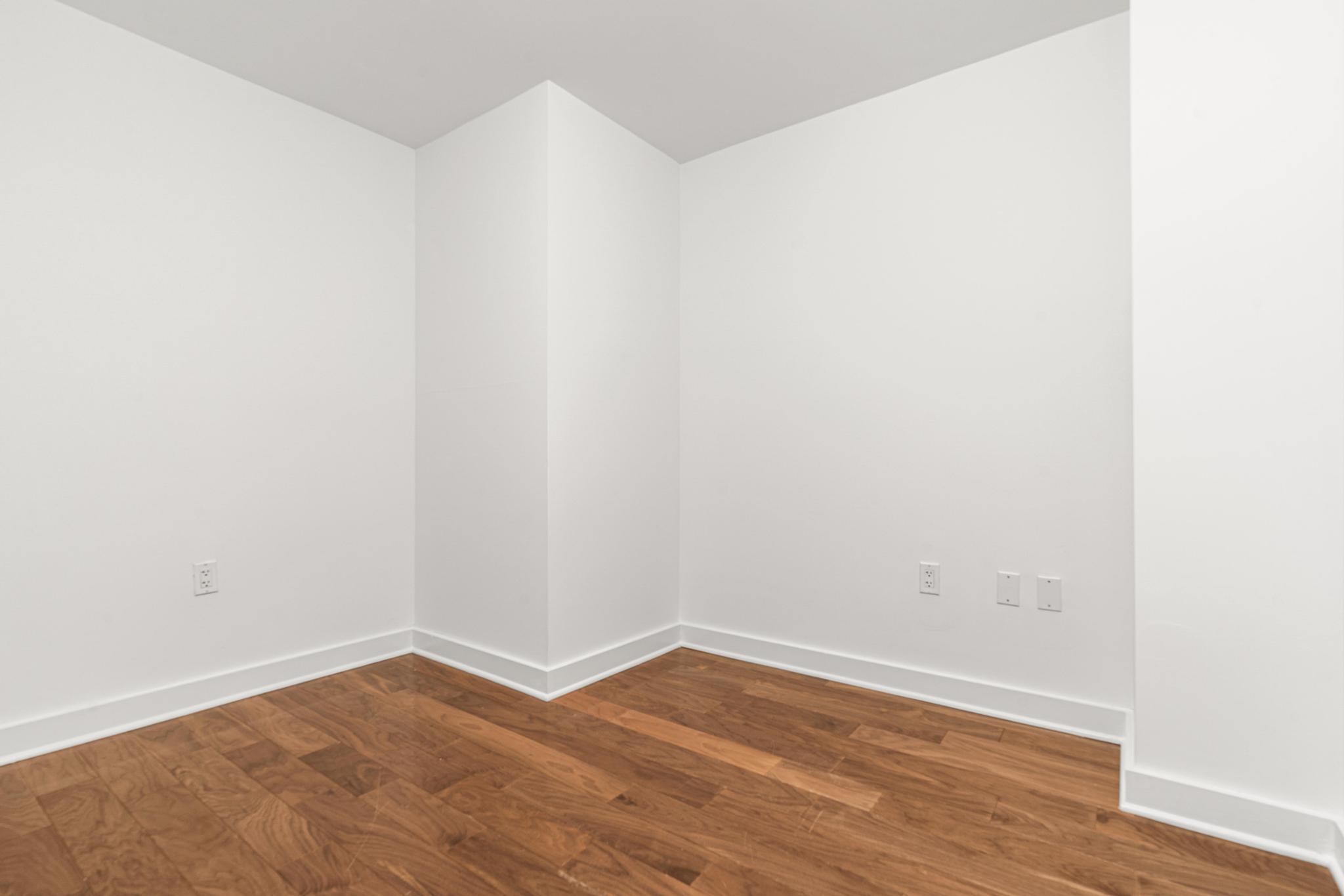 2 Northside Piers, Unit 5U Brooklyn, NY 11249 - Photo 11 of 12 a view of an empty room with wooden floor