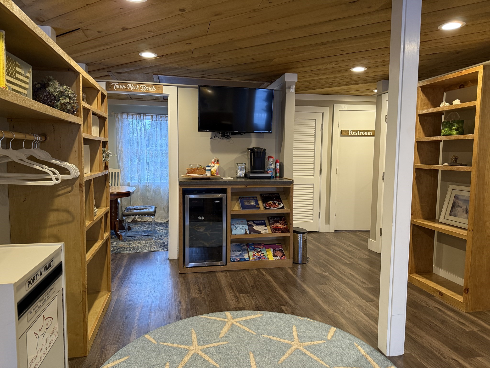 68 Tupper Road, Unit 8 Sandwich, MA 02563 - Photo 4 of 9 a open kitchen with wooden floors and a fireplace
