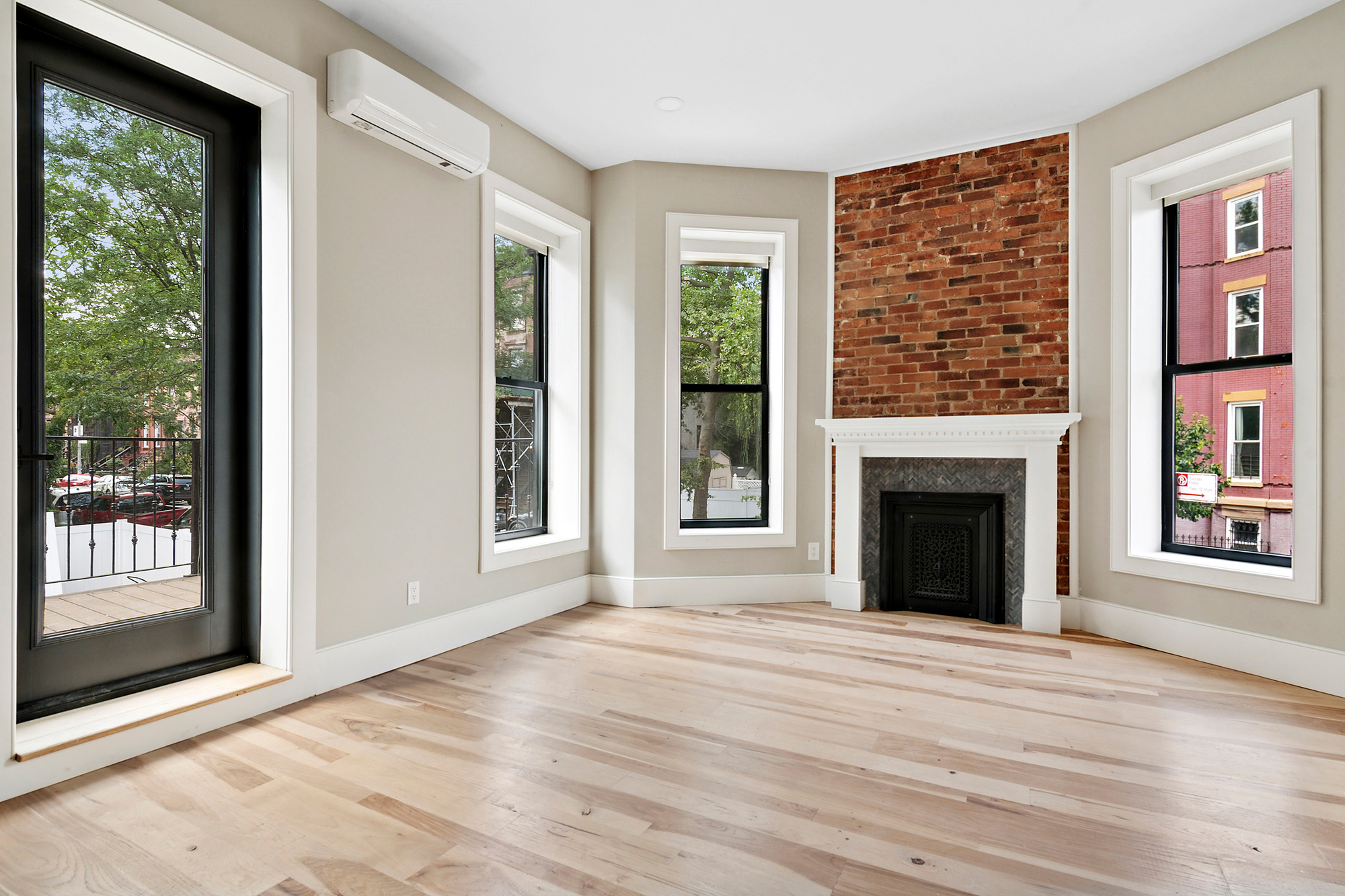 264 Stuyvesant Avenue, Unit 2 Brooklyn, NY 11221 - Photo 1 of 9 a view of an empty room with window and fire place