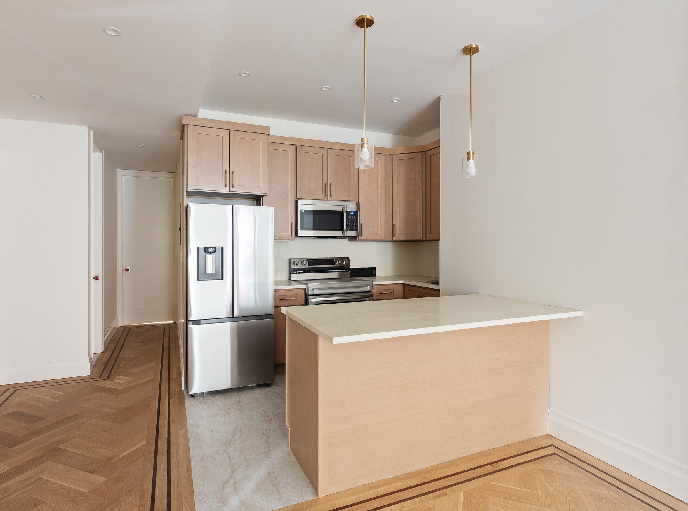 80 7th Avenue, Unit 2 Brooklyn, NY 11217 - Photo 2 of 8 a kitchen with a refrigerator a stove and a sink