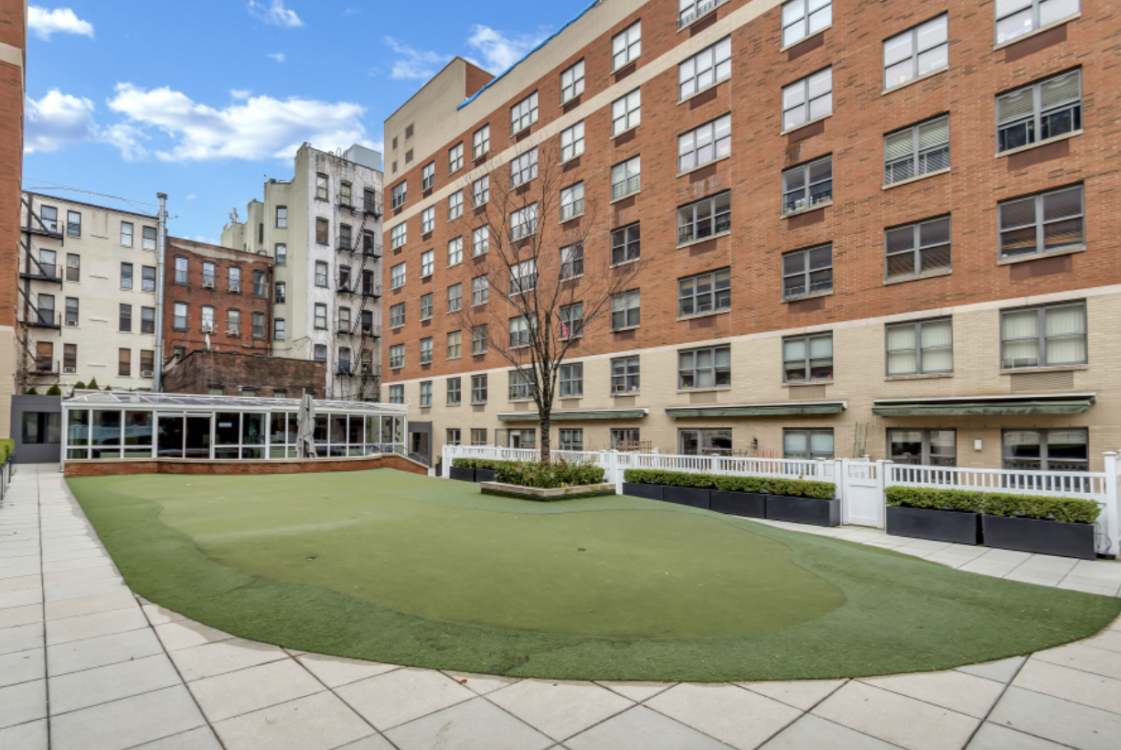 516 West 47th Street, Unit S6L Manhattan, NY 10036 - Photo 10 of 12 a view of a building with a yard