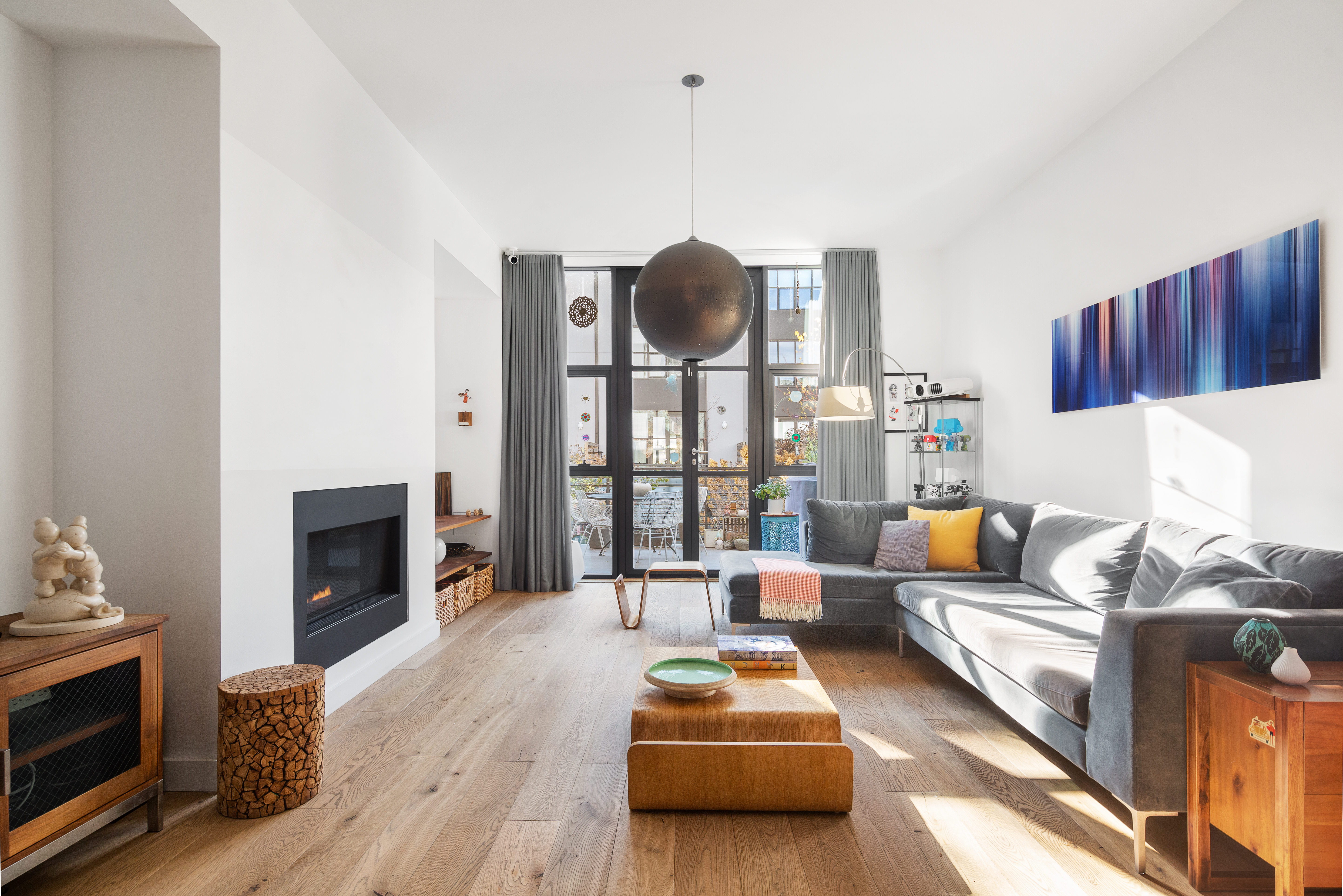 125 King Street Brooklyn, NY 11231 - Photo 1 of 12 a living room with furniture a fireplace and a flat screen tv