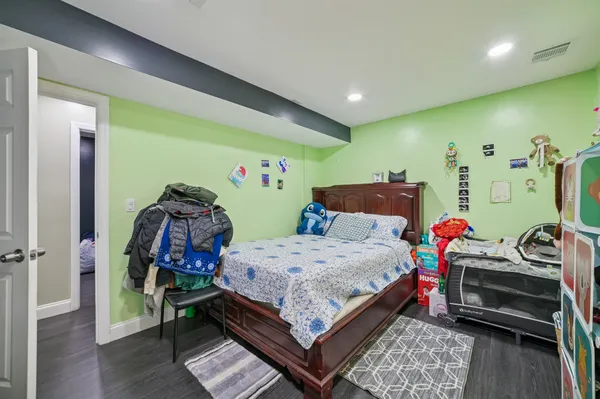 a bedroom with two beds and a tv