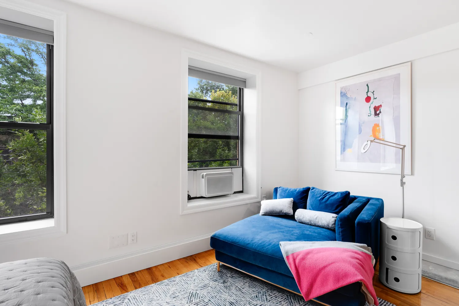 a bedroom with furniture and a window