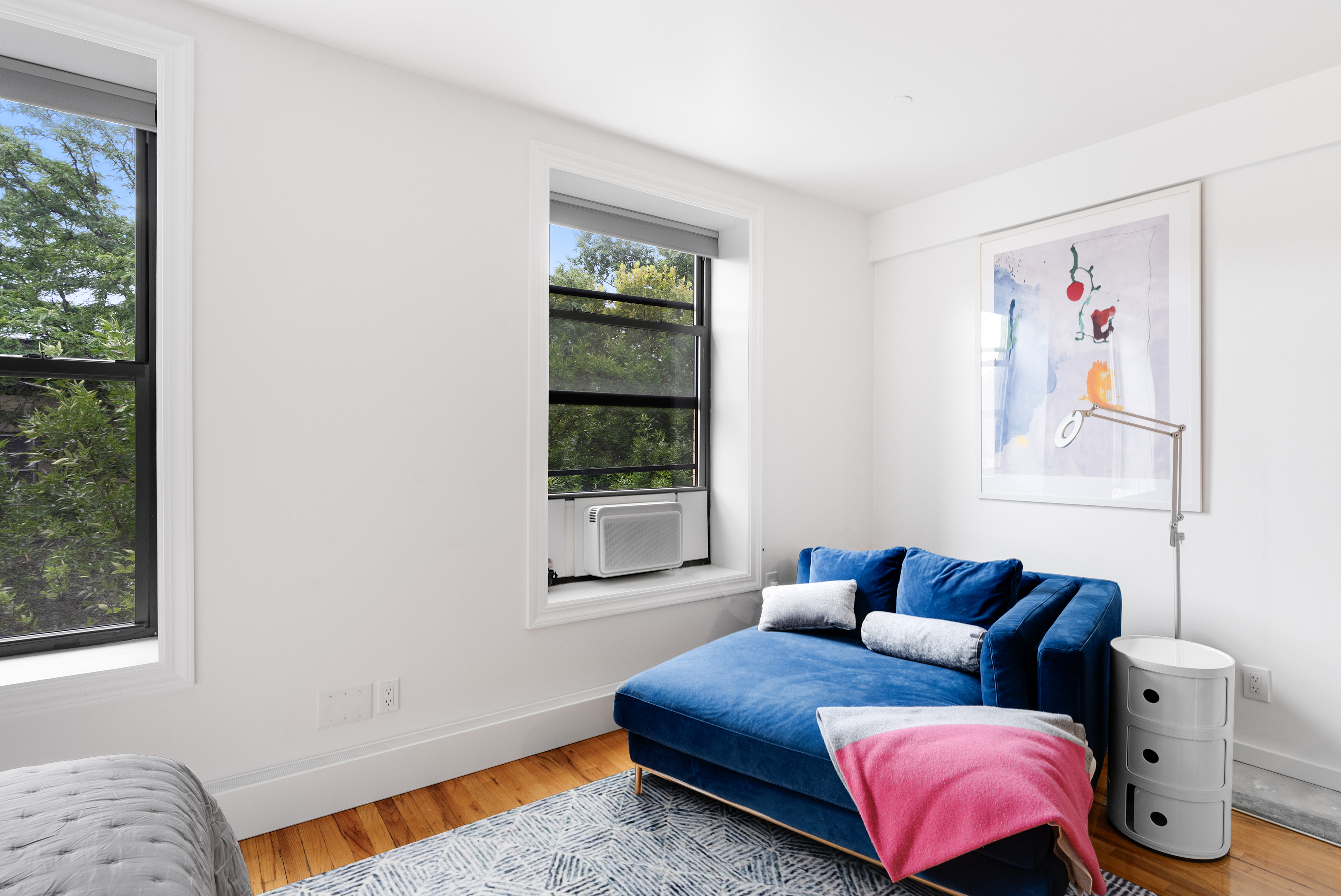 235 West 137th Street, Unit 4F Manhattan, NY 10030 - Photo 4 of 7 a bedroom with furniture and a window