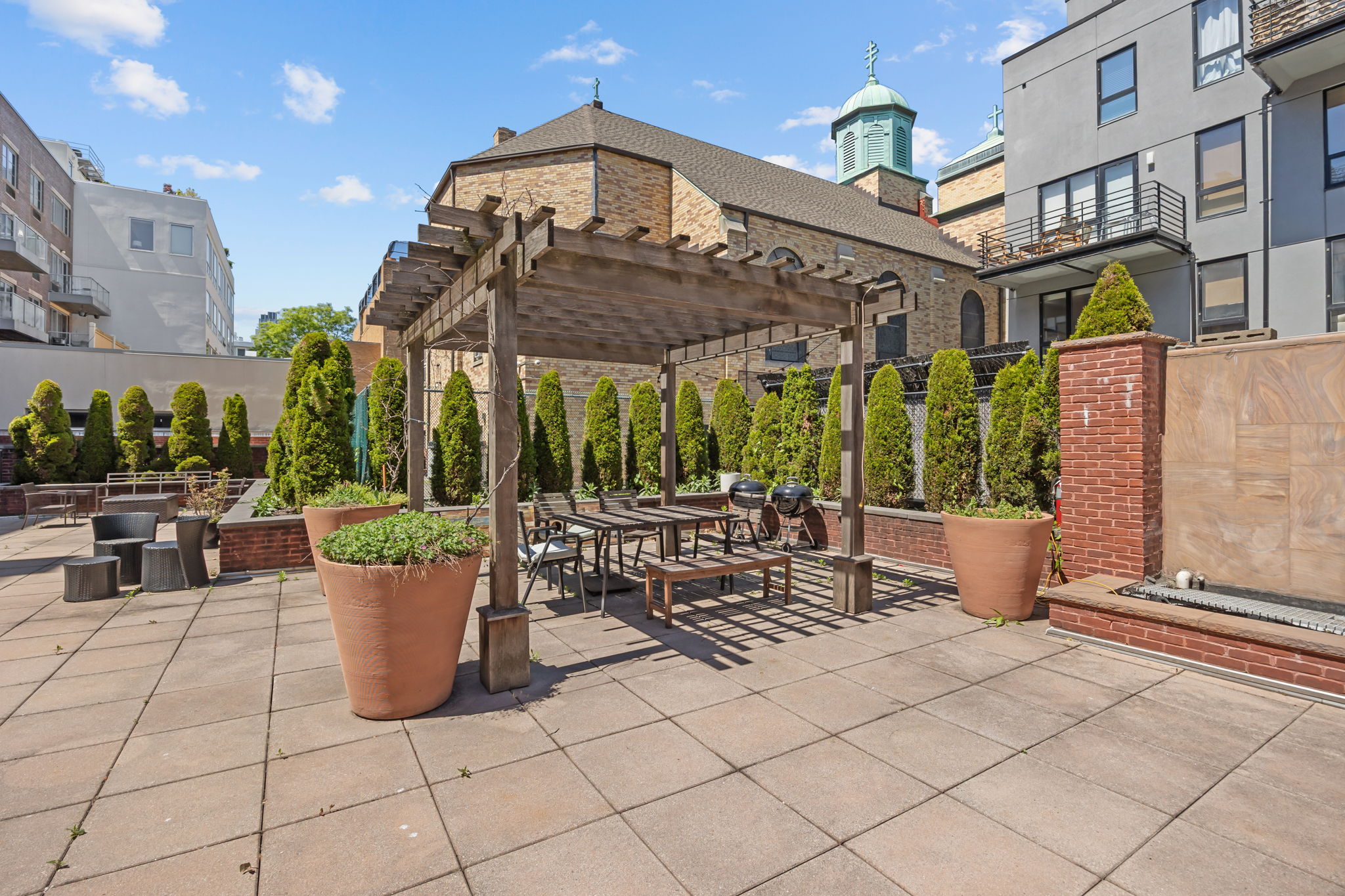 161 North 4th Street, Unit 1C Brooklyn, NY 11211 - Photo 8 of 10 a view of a patio with table and chairs potted plants