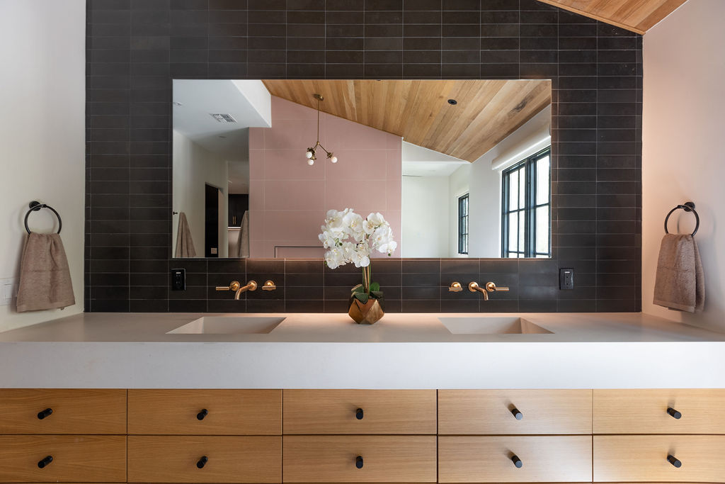 400 Inwood Road Austin, TX 78746 - Photo 28 of 43 a bathroom with a sink and a mirror