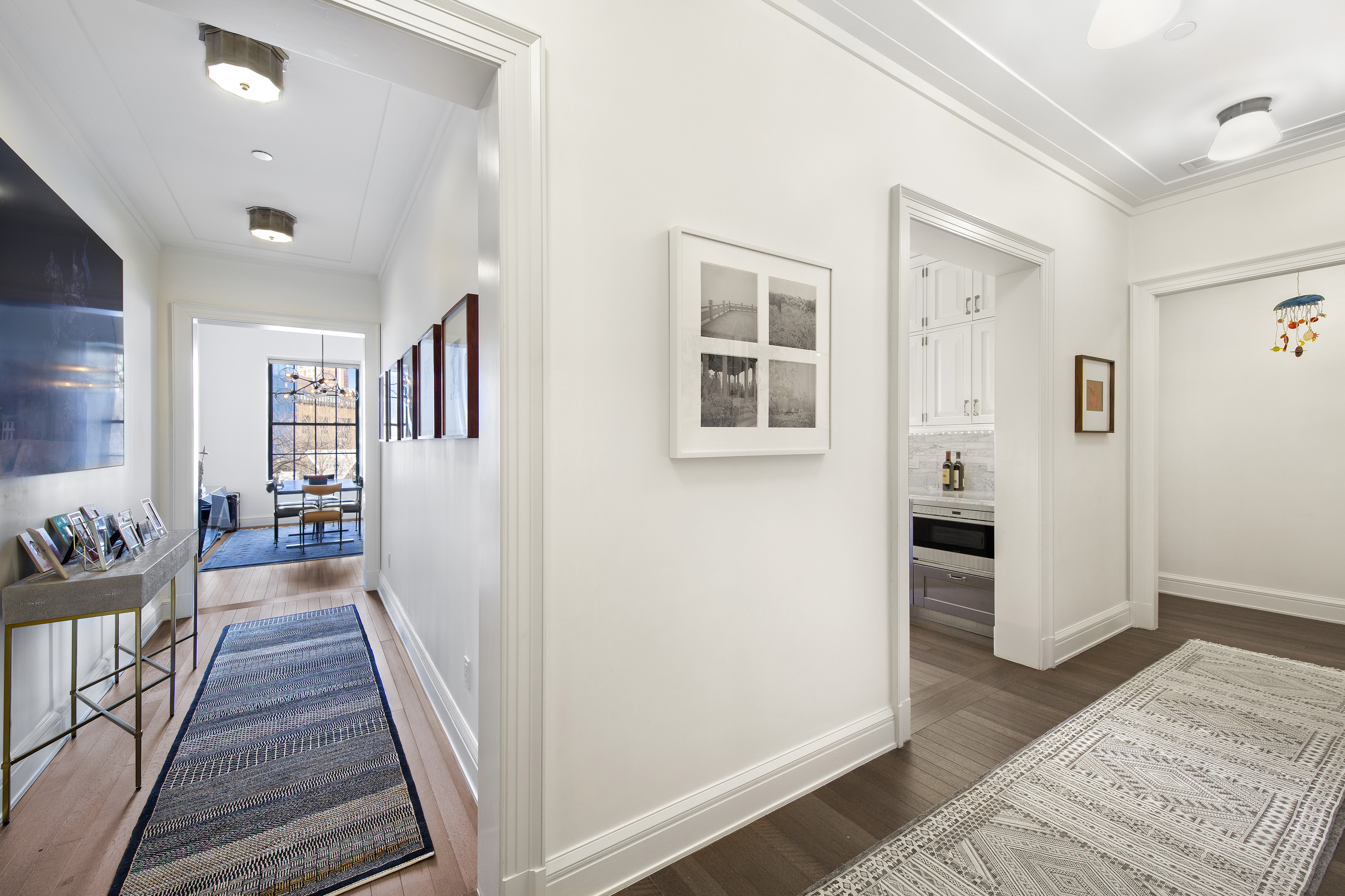160 West 12th Street, Unit 28 Manhattan, NY 10011 - Photo 3 of 9 a view of a hallway with wooden floor and windows