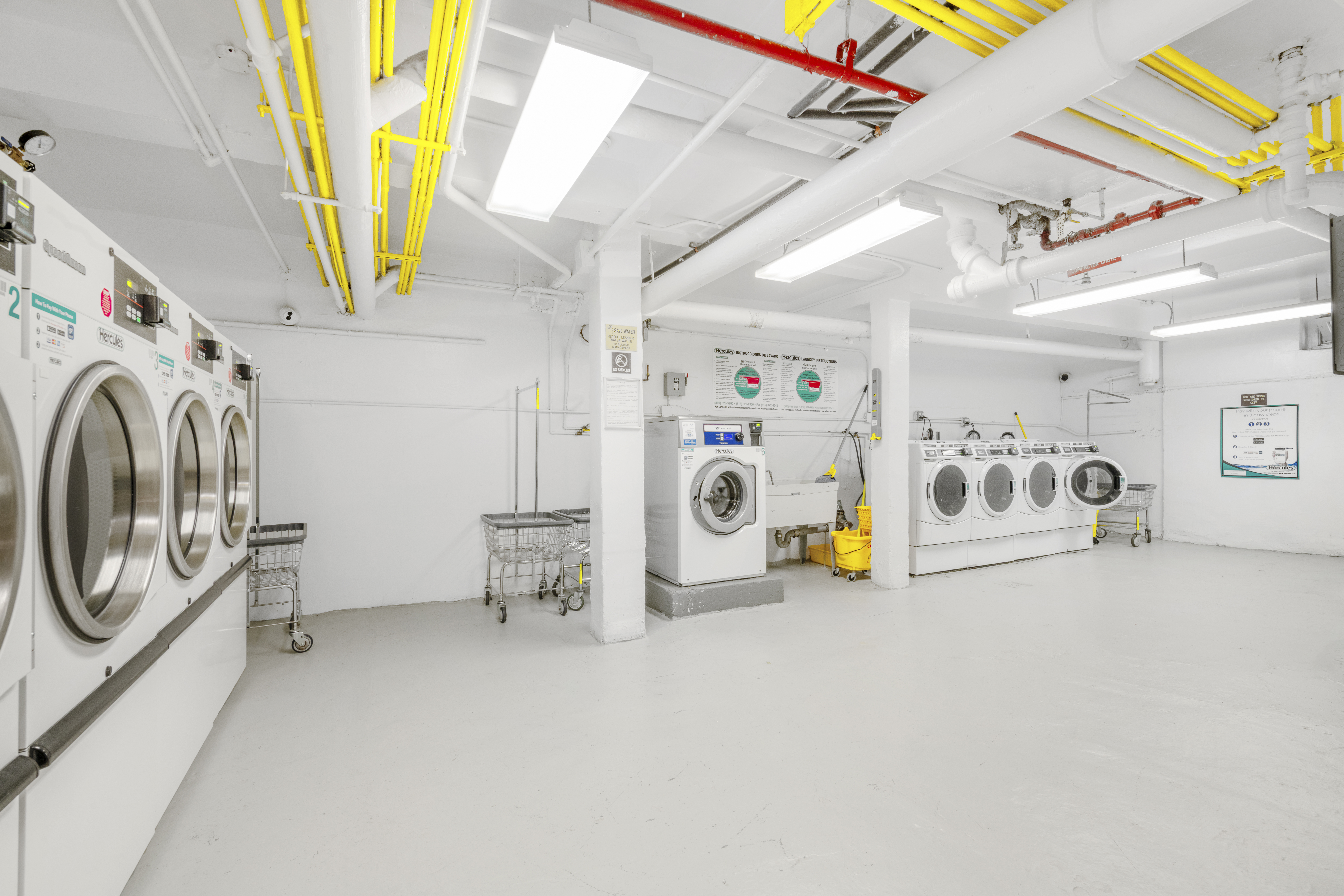 515 East 89th Street, Unit 2E Manhattan, NY 10128 - Photo 13 of 17 a view of hallway with washer and dryer