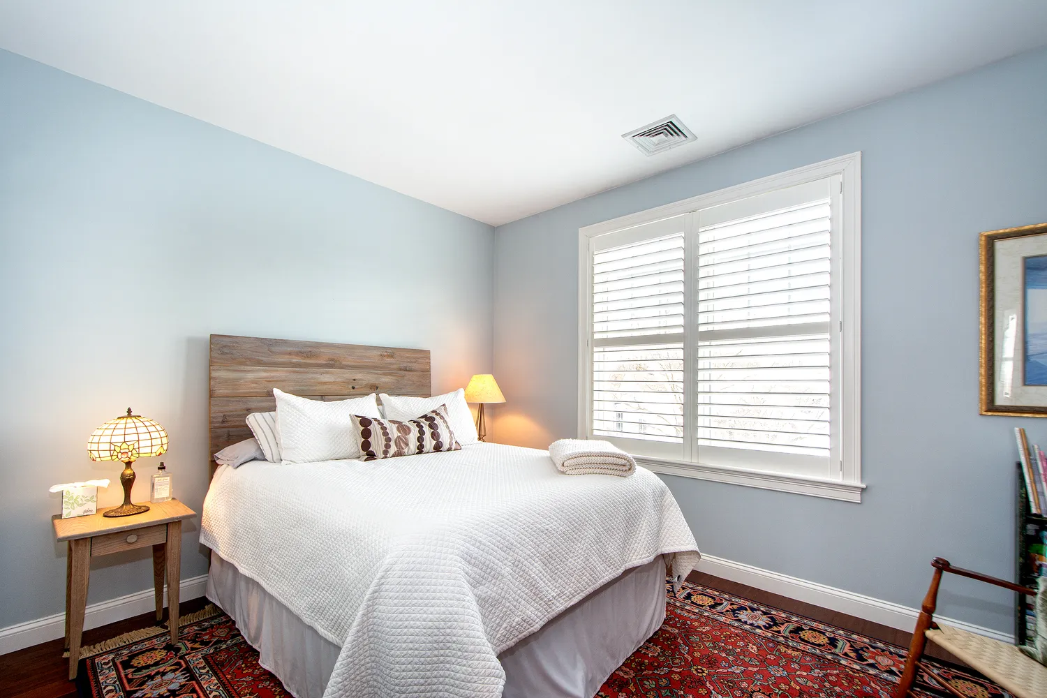 a bedroom with furniture and a chandelier
