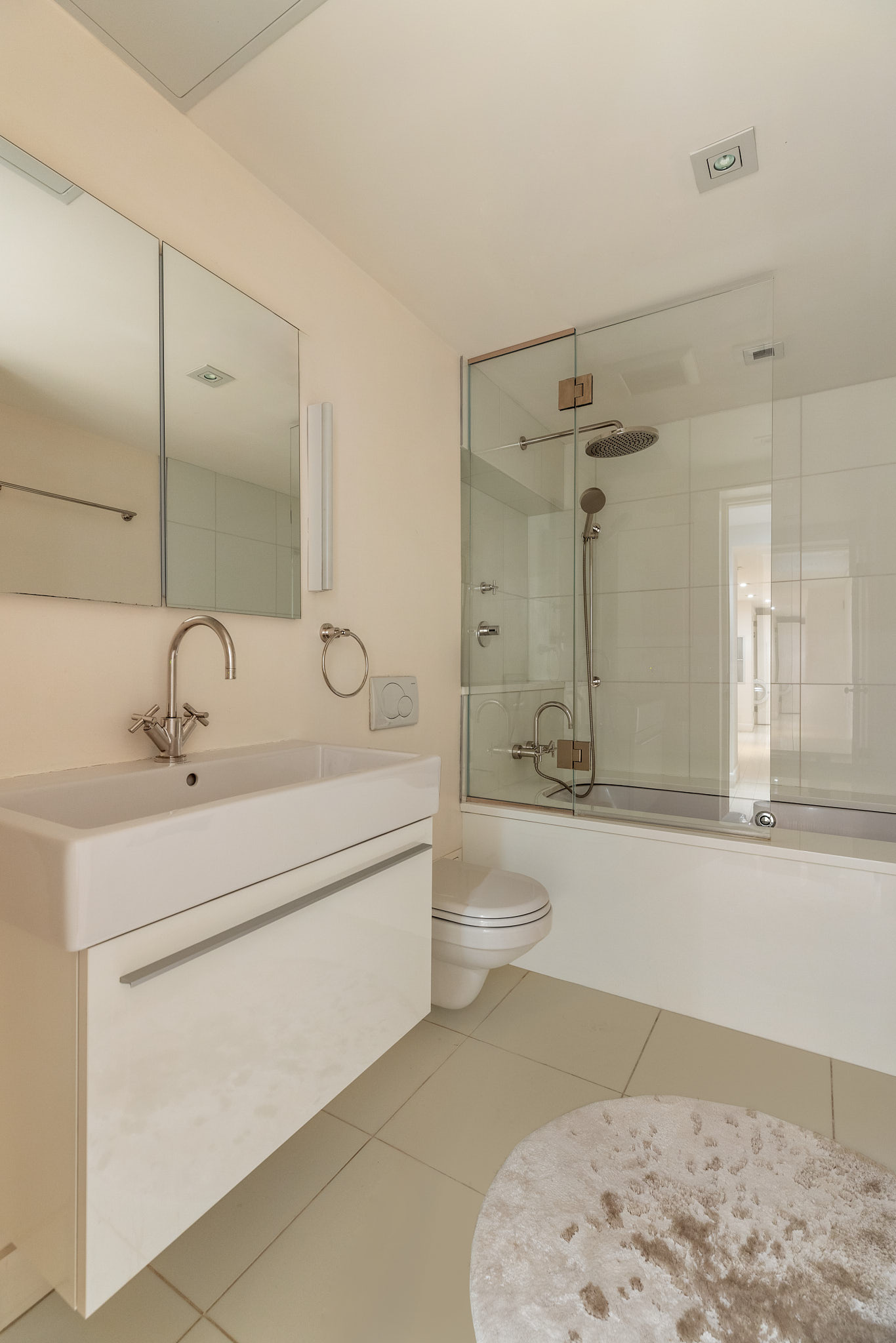13 Vandam Street Manhattan, NY 10014 - Photo 25 of 26 a bathroom with a sink a toilet and shower