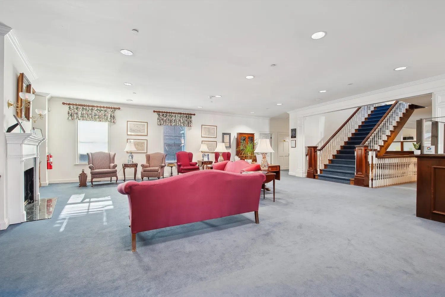 a view of a dining room with furniture and a window