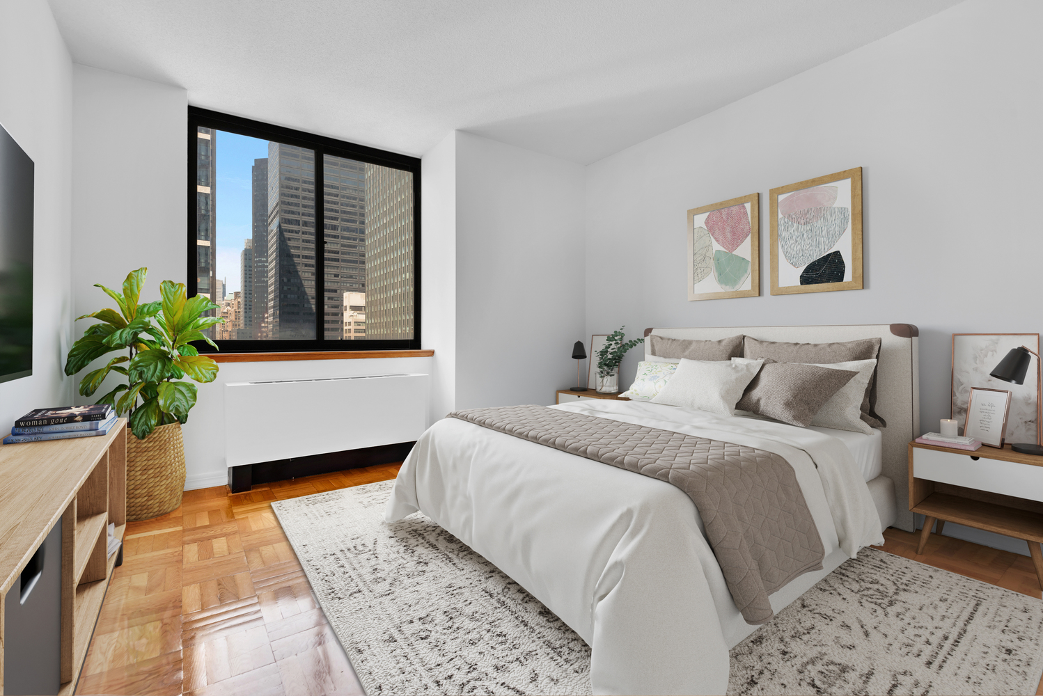 250 East 40th Street, Unit 22B Manhattan, NY 10016 - Photo 7 of 13 a bedroom with bed and a window