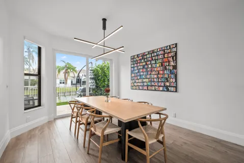 an aerial view of a house with outdoor space swimming pool and lake view