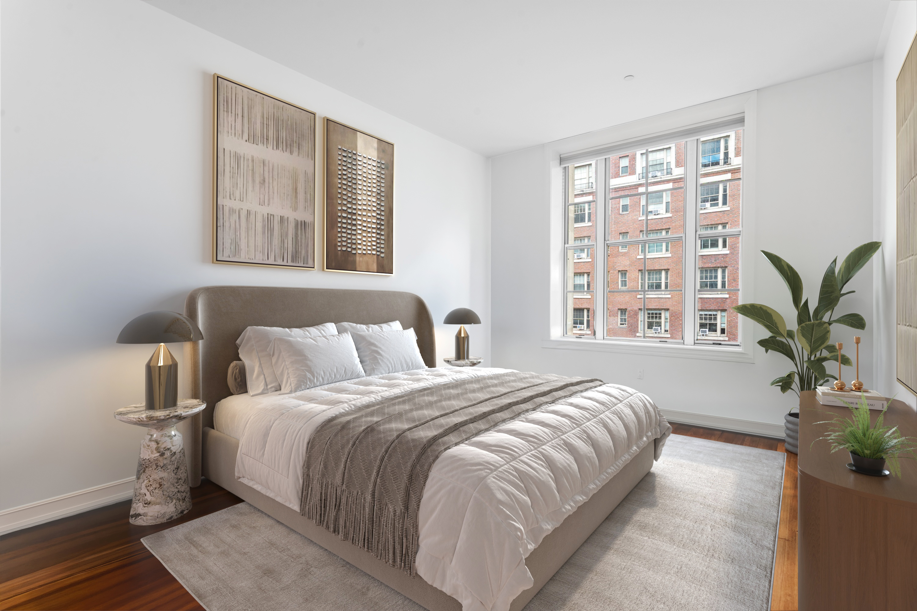 2112 Broadway, Unit 5F Manhattan, NY 10023 - Photo 5 of 9 a bedroom with a large bed and a potted plant