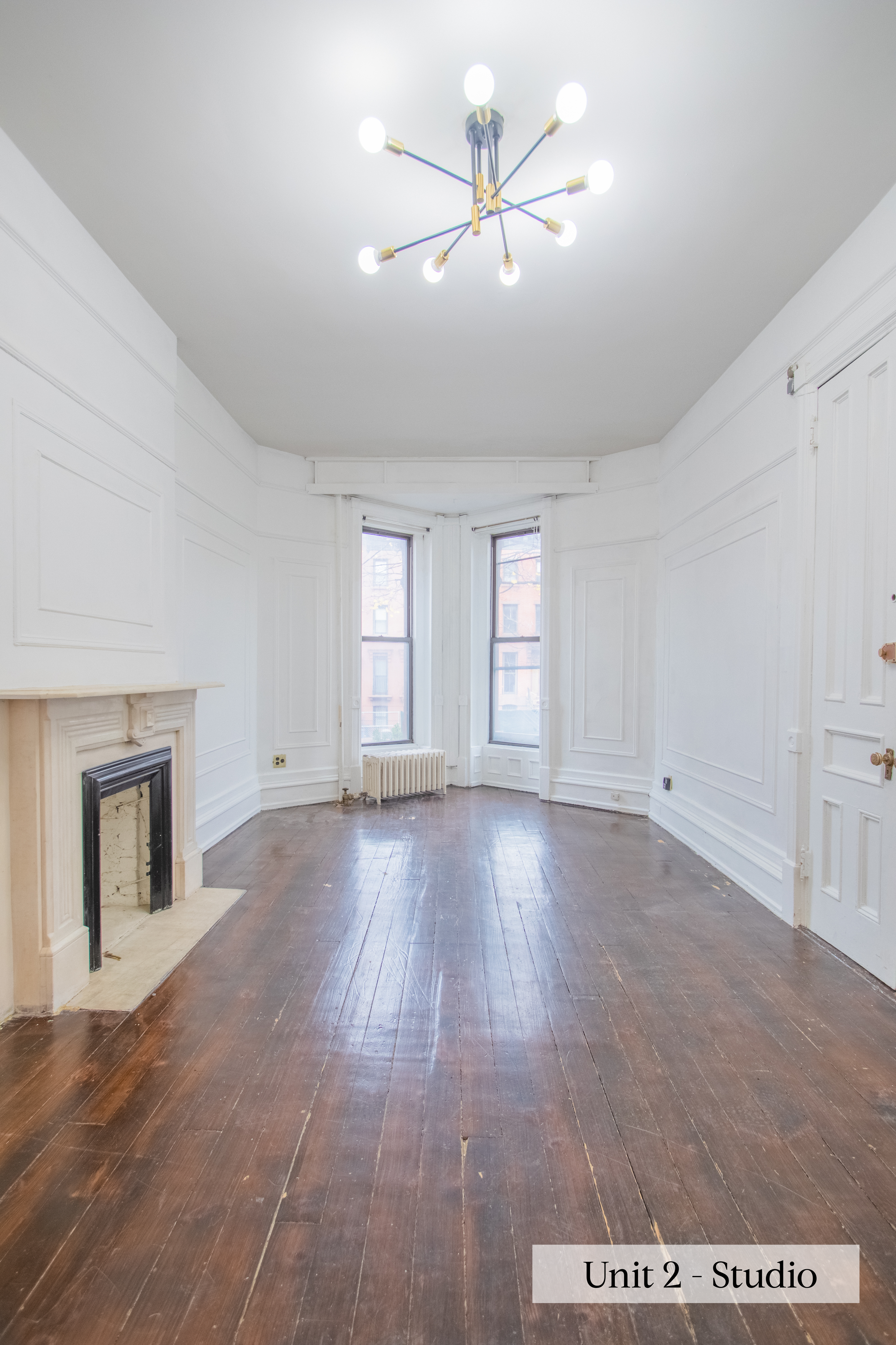 460 9th Street Brooklyn, NY 11215 - Photo 18 of 24 a view of an empty room with a window and wooden floor