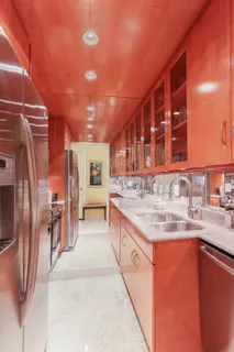 a kitchen with stainless steel appliances granite countertop a sink and cabinets