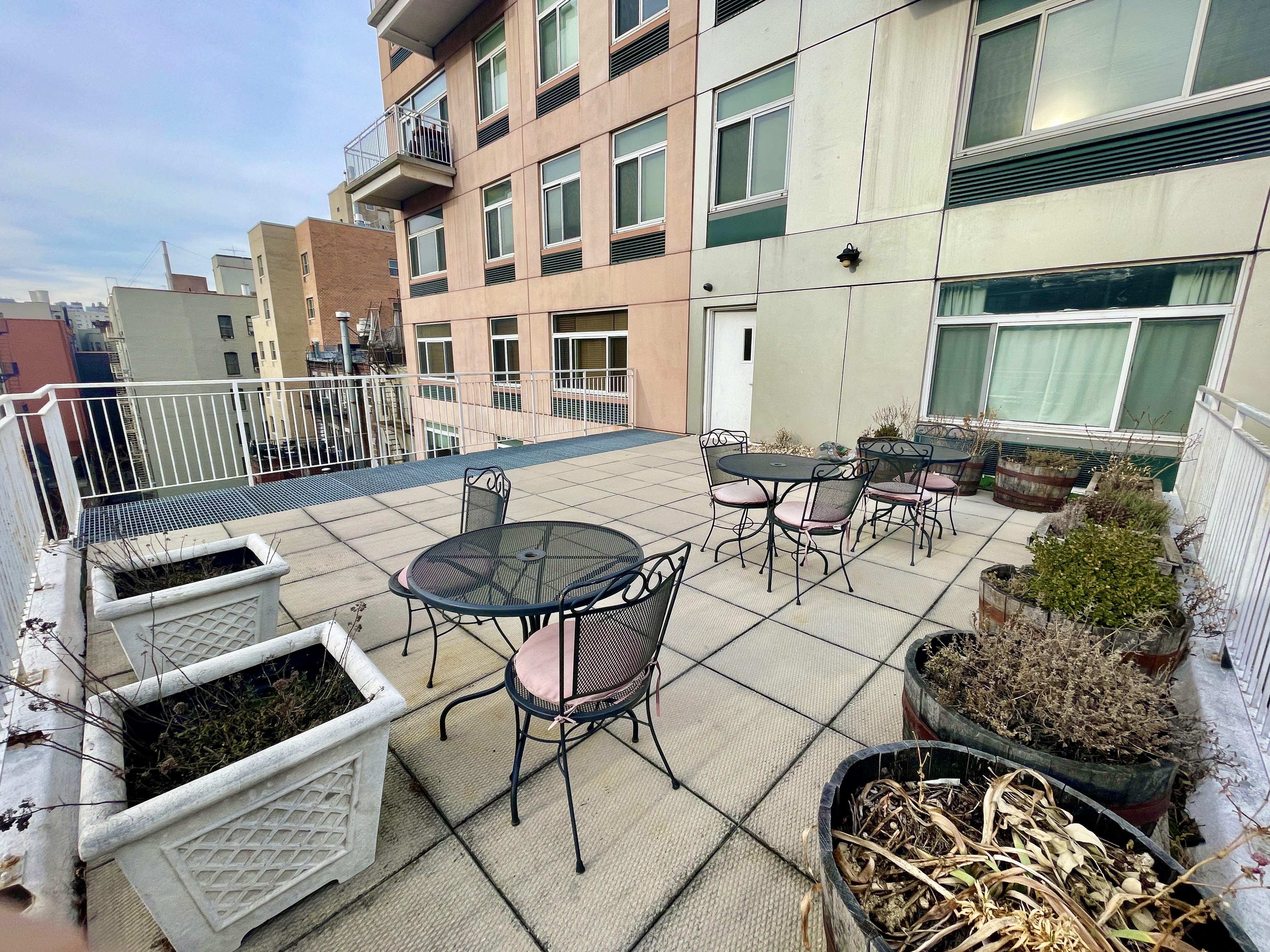 106 West 116th Street, Unit 12A Manhattan, NY 10026 - Photo 11 of 13 a view of balcony with chairs and table